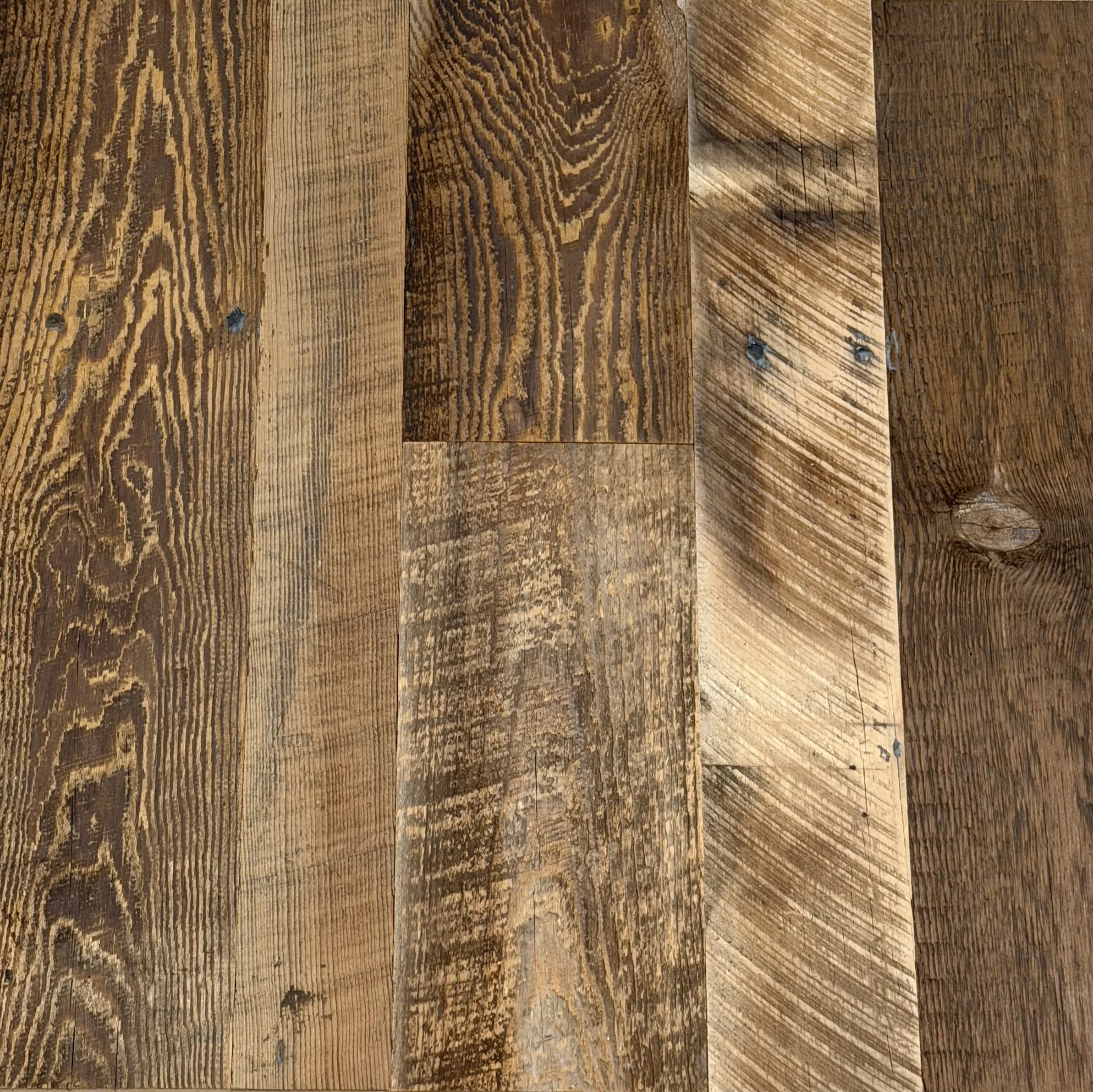 Close-up of a wooden surface with visible grain patterns and knots.