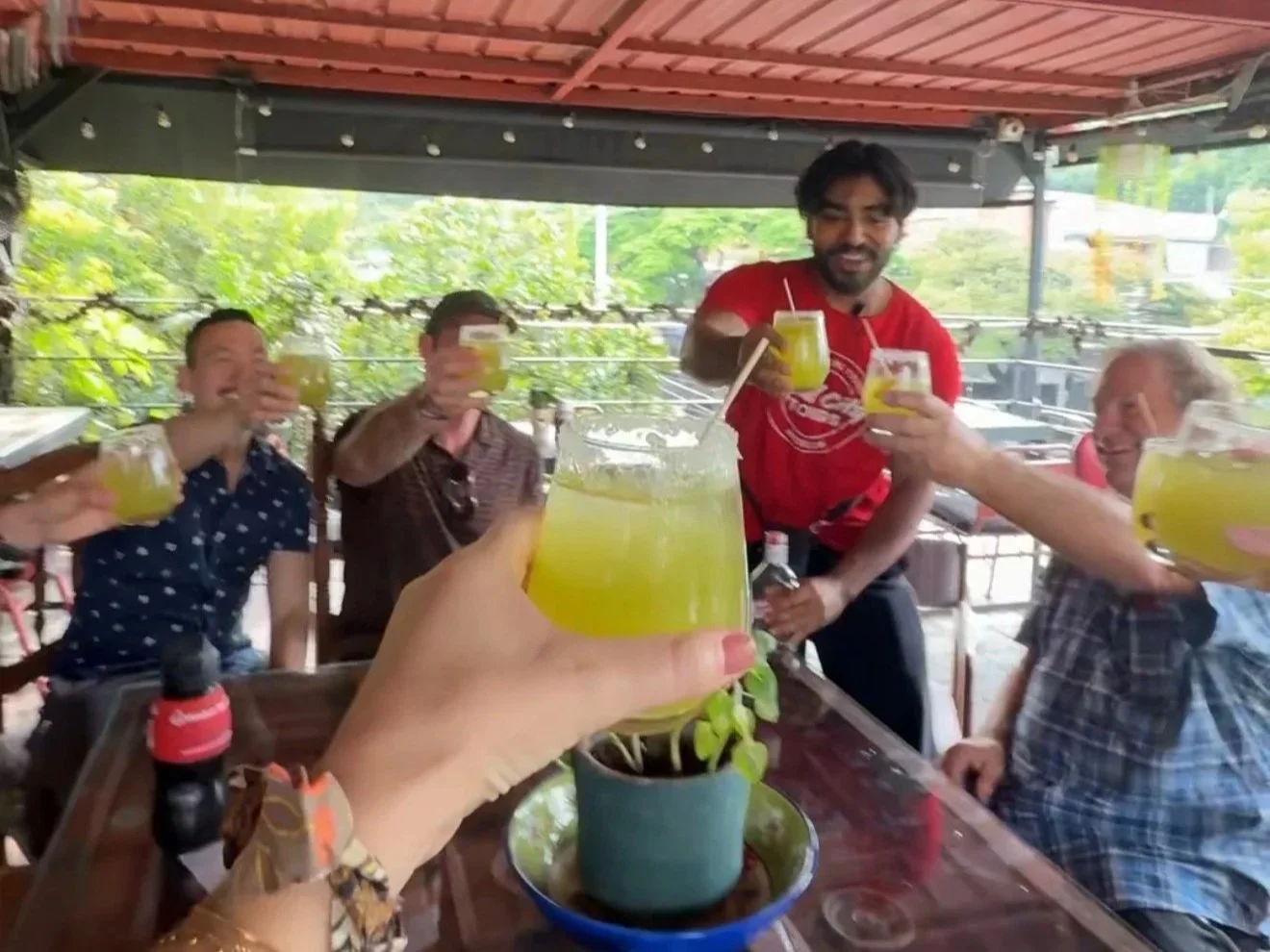 Lemonade cheers with our group at the Laureles Food Tour with Real City Tours in Medellin Colombia