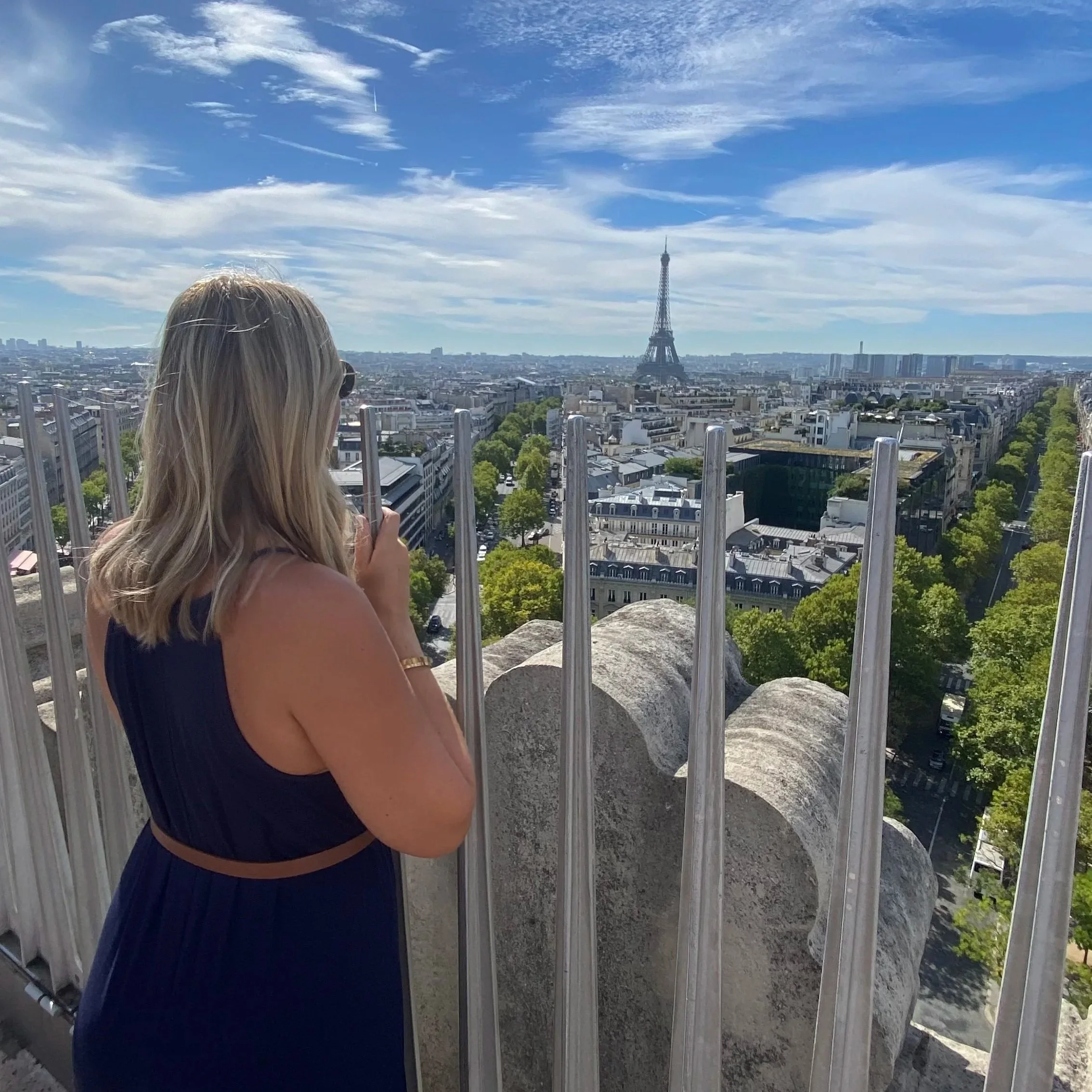 Megan looking at the Eiffel Tower in Paris, France