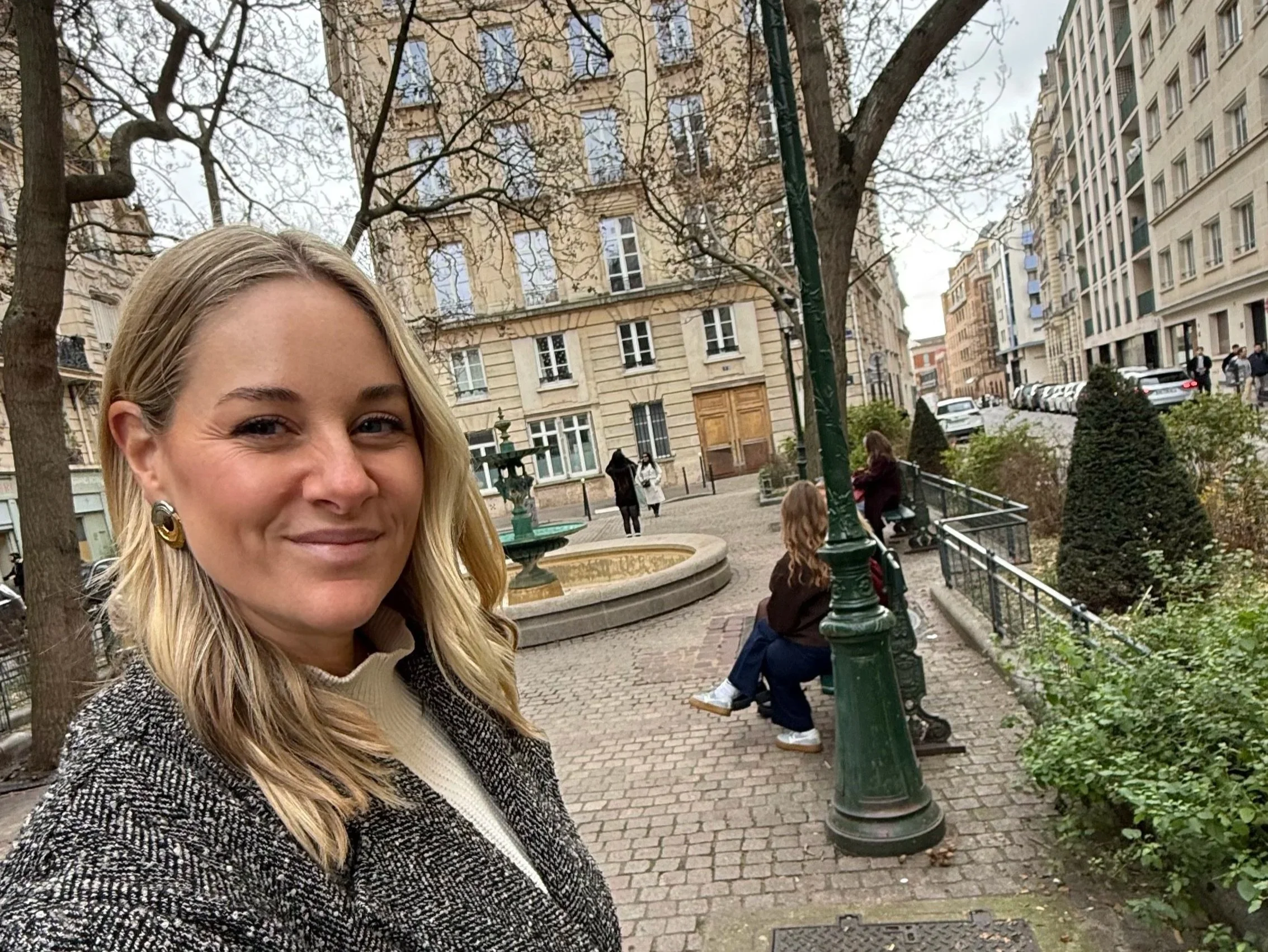 Megan in front of Place de l'Estrapade from Emily in Paris