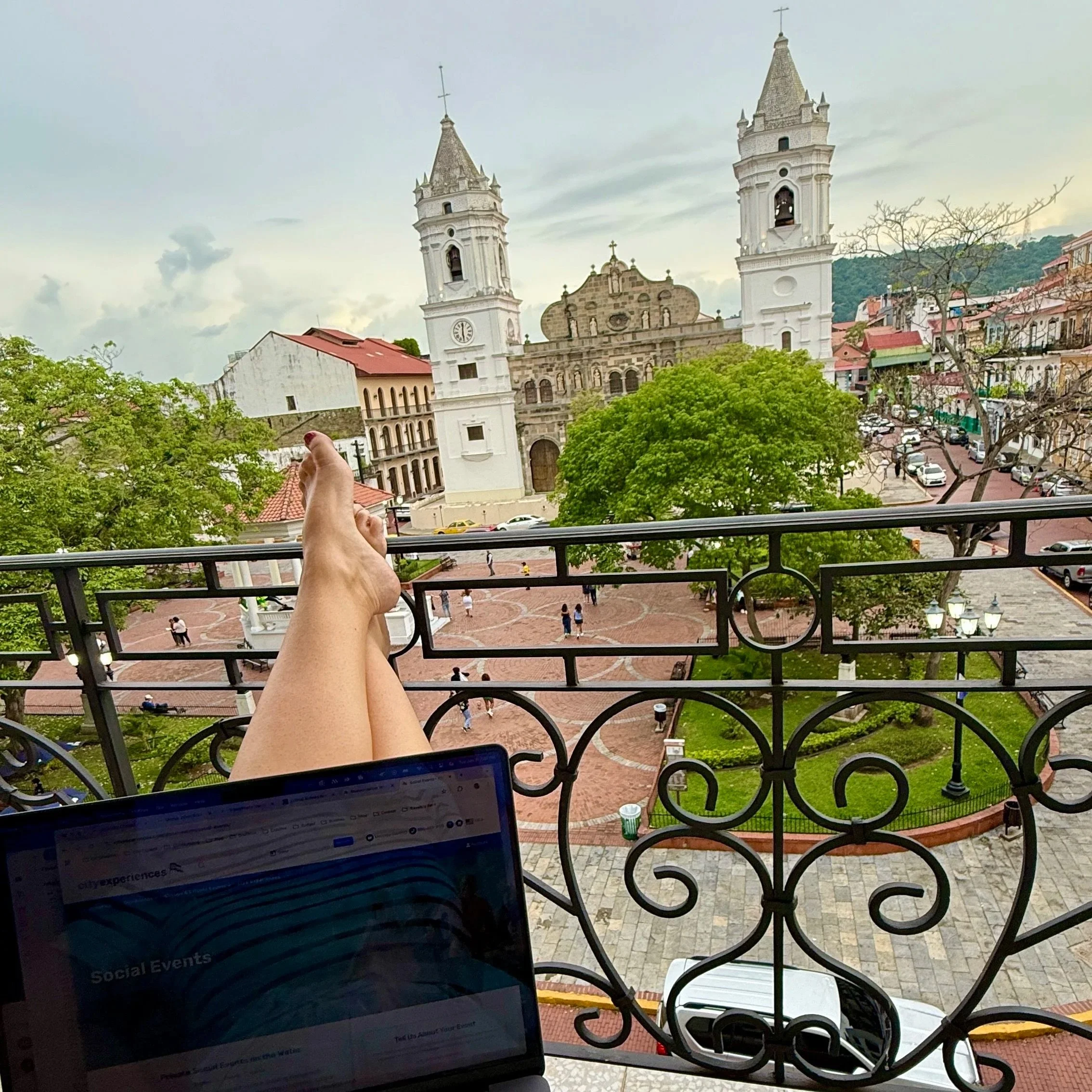 Megan working remotely from a balcony overlooking Plaza de la Independencia in Panama City