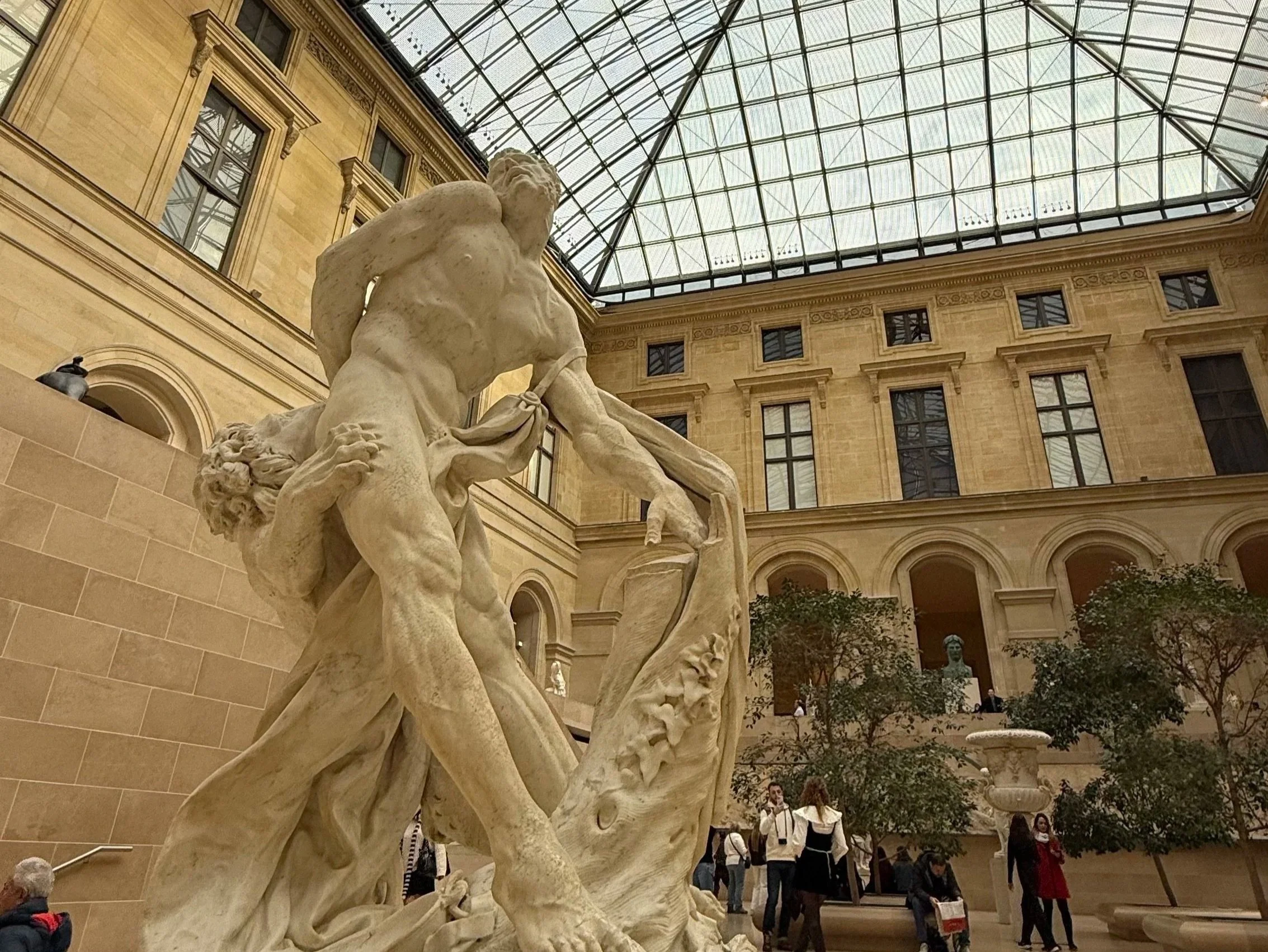 Statue in Cour Marly inside the Louvre in Paris, France