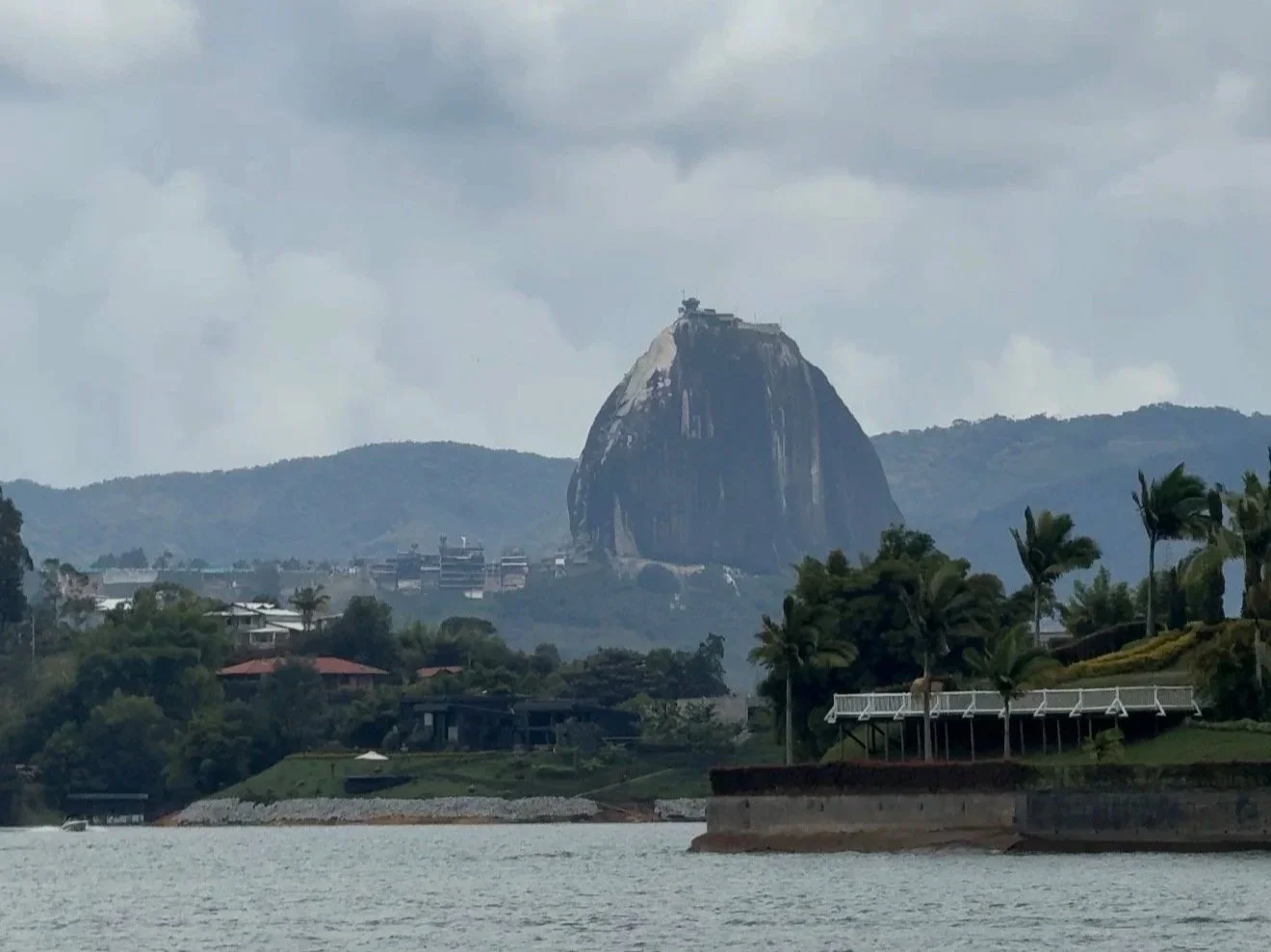 View of La Piedra del Piñol in Guatapé, Colombia as seen from the reservoir