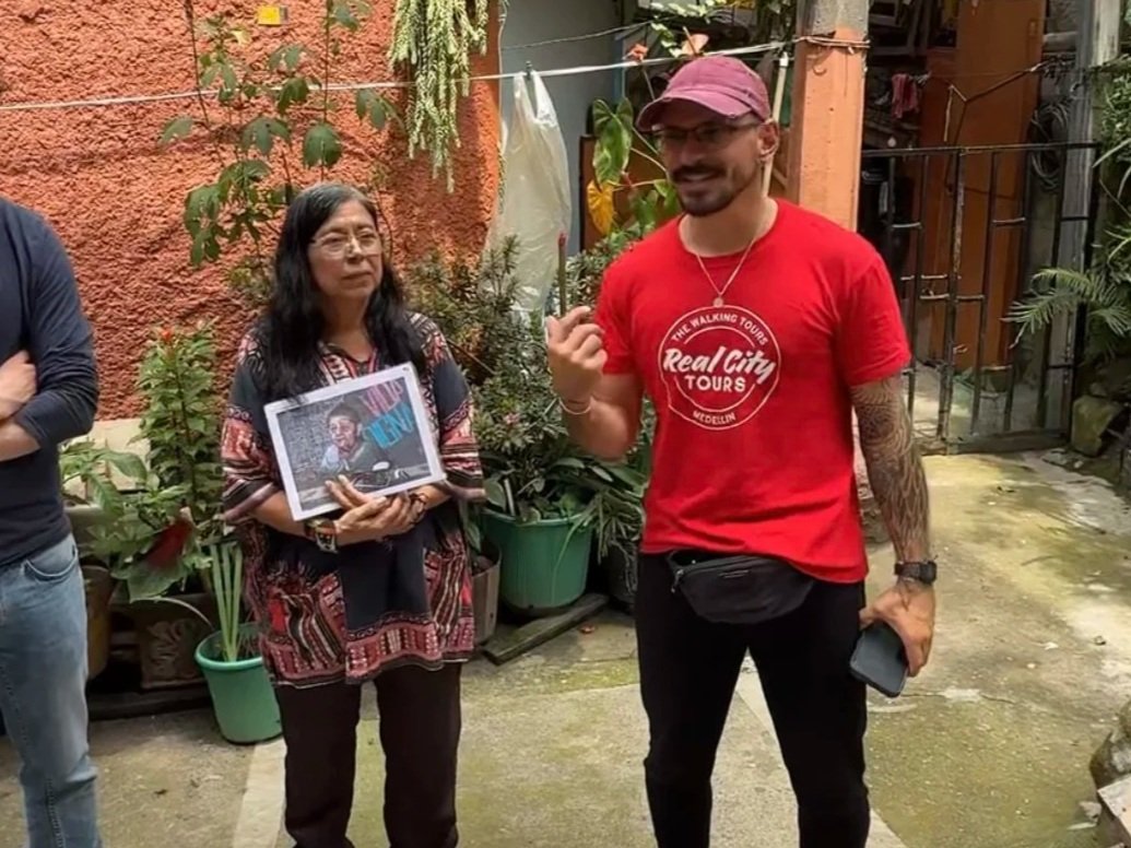Tour guide Toto and Community Leader Heroina in Moravia in Comuna 4 on the Barrio Transformation Tour with Real City Tours in Medellin Colombia
