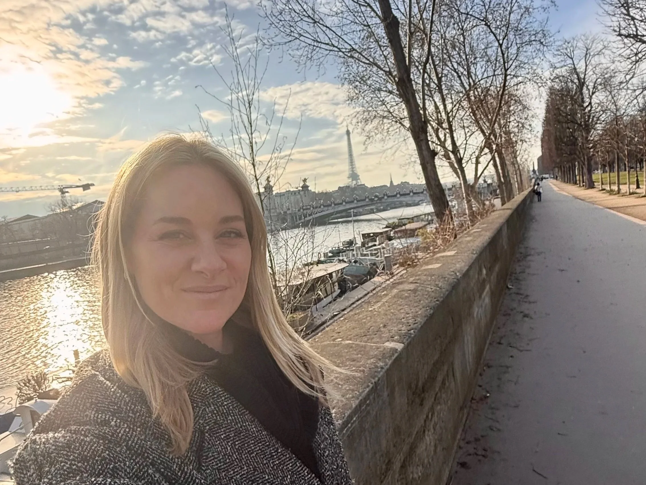 Megan at the Seine River with the Eiffel Tower in Paris France