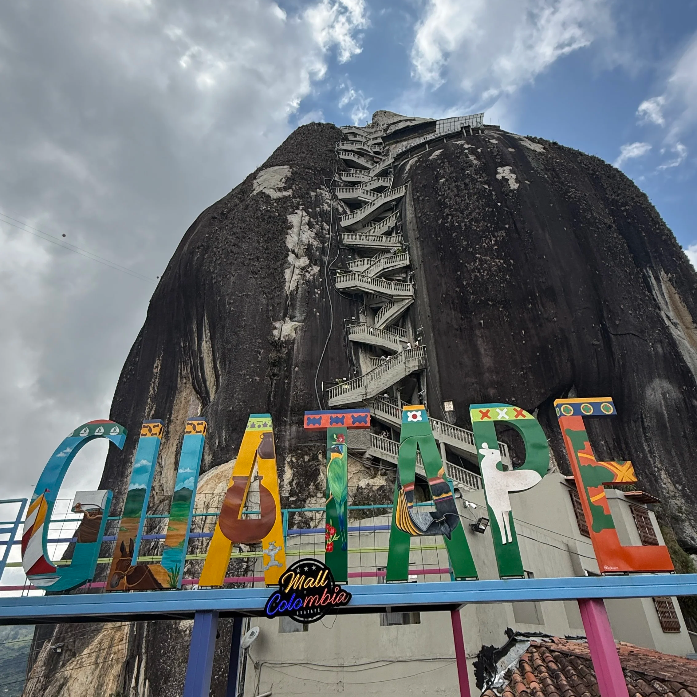 View of La Piedra del Piñol in Guatapé, Colombia as seen from the bottom with the staircase in the mountain