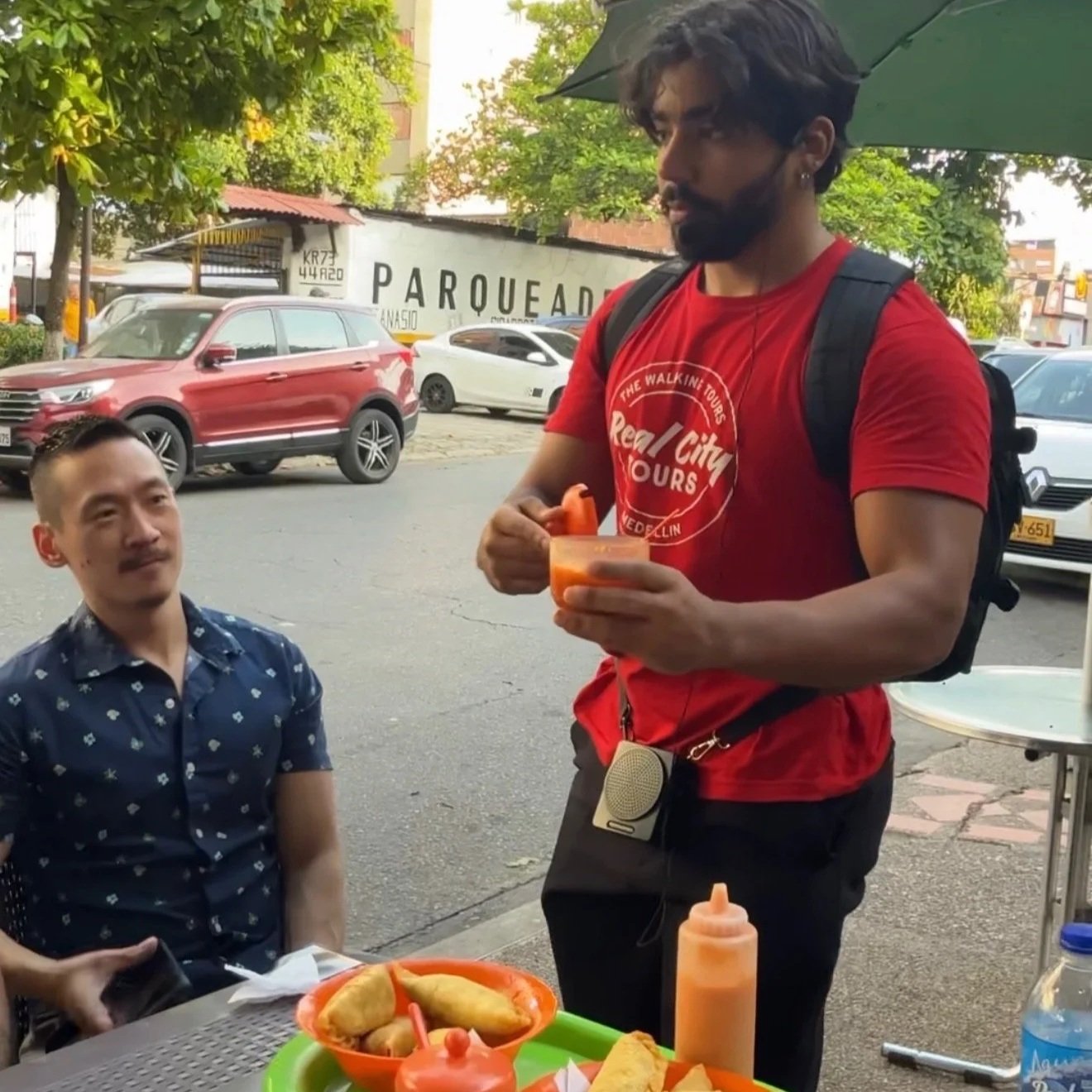 Tour Guide explaining the food on the Laureles Food Tour with Real City Tours in Medellin, Colombia