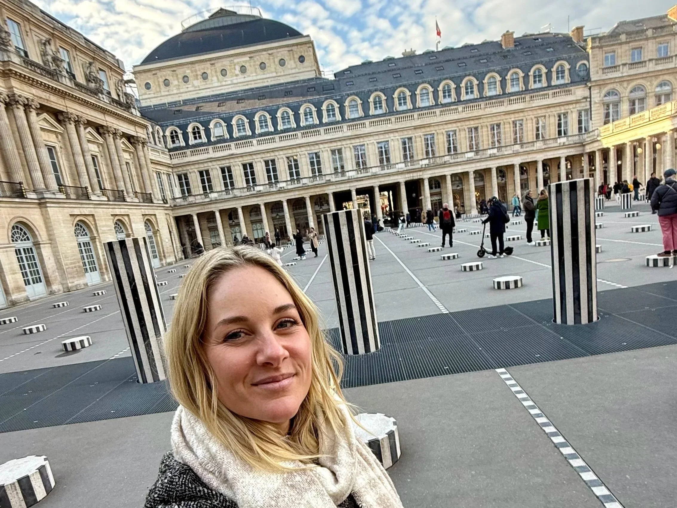 Megan at the Palais Royal with the striped columns in Paris, France