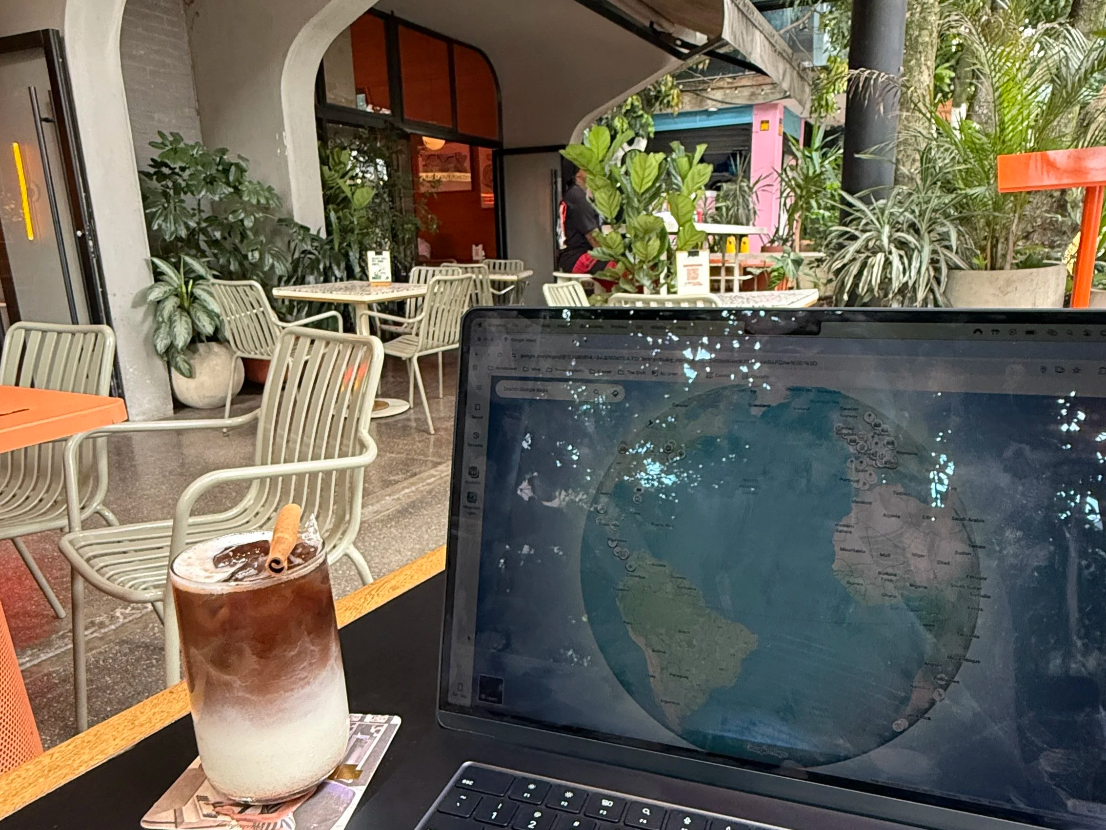 Remote work life with laptop and chai latte in a cafe in Medellin Colombia