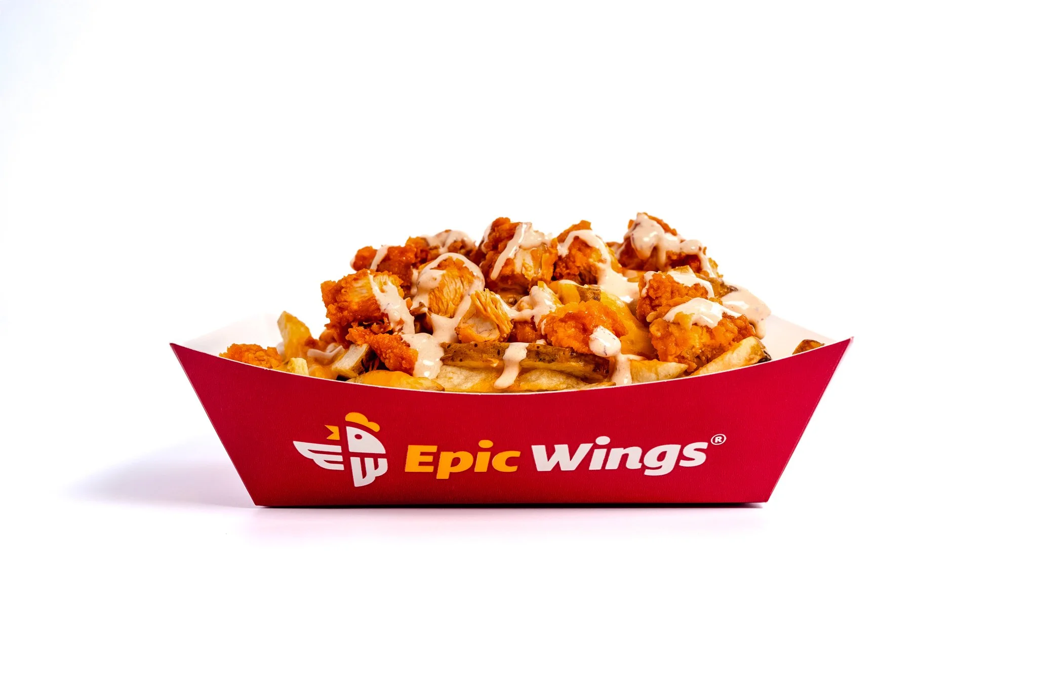 A red box of Epic Wings chicken wings with white dipping sauce on top, labeled Epic Wings.
