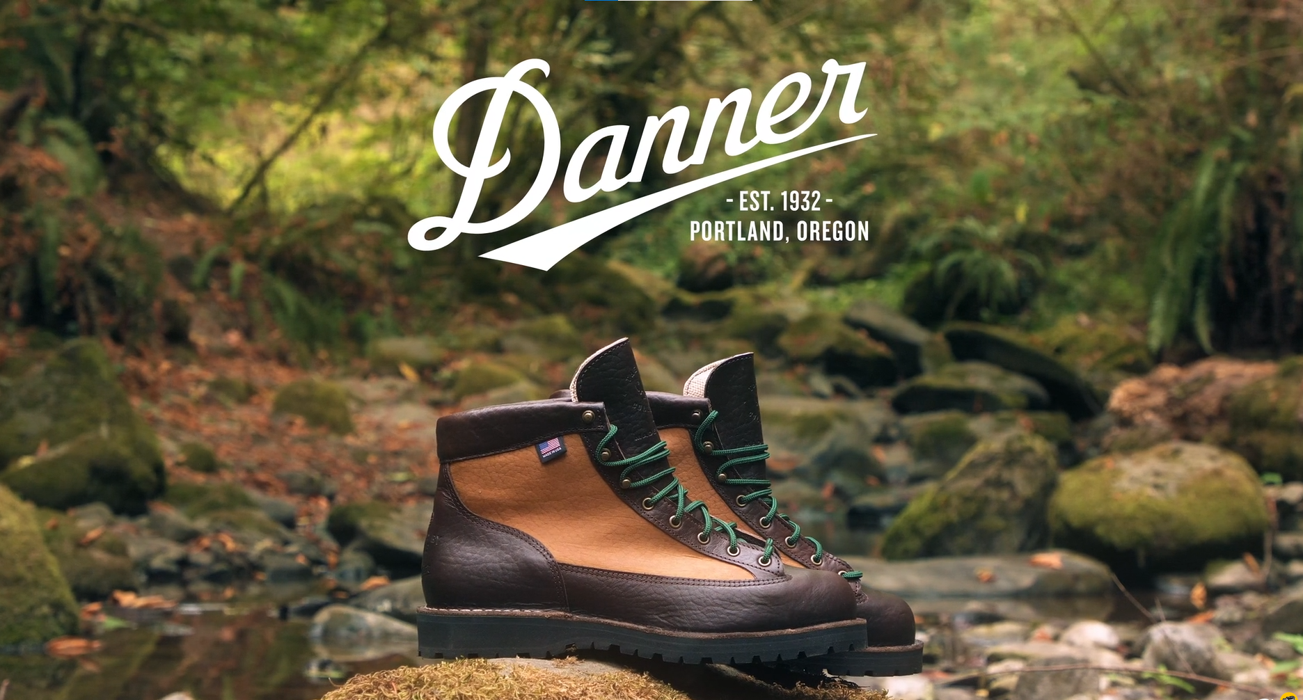 A pair of Danner hiking boots in front of a forest stream with moss-covered rocks and lush greenery, with the Danner logo, established 1932 in Portland, Oregon, overlaid.