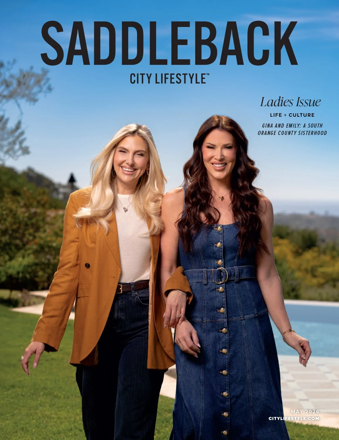 Cover of Saddleback City Lifestyle magazine, May 2026 issue, featuring two women smiling outdoors against a blue sky, with trees and a swimming pool in the background. Title: Saddleback City Lifestyle, Ladies Issue, with a focus on life and culture, 