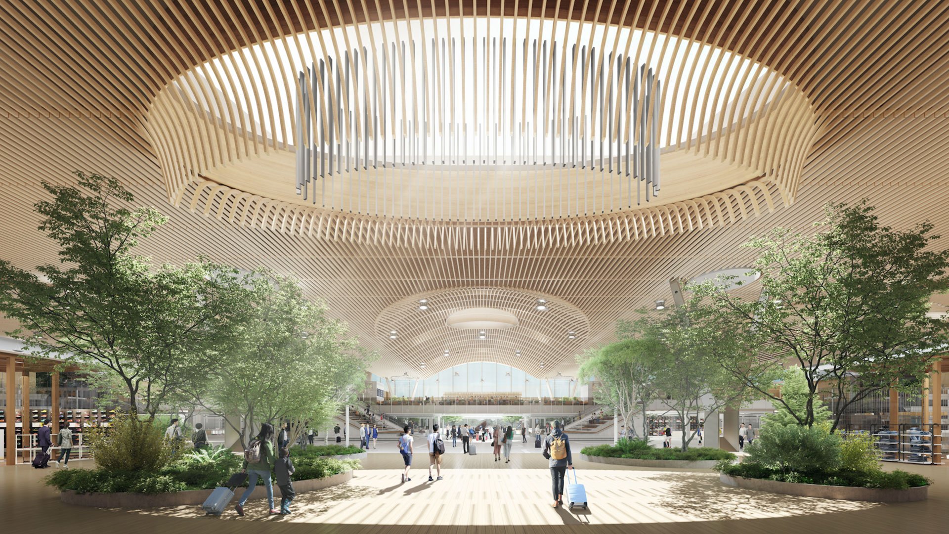 Interior of a modern transportation hub with a wooden slat ceiling, large open space, trees, and people walking with luggage.