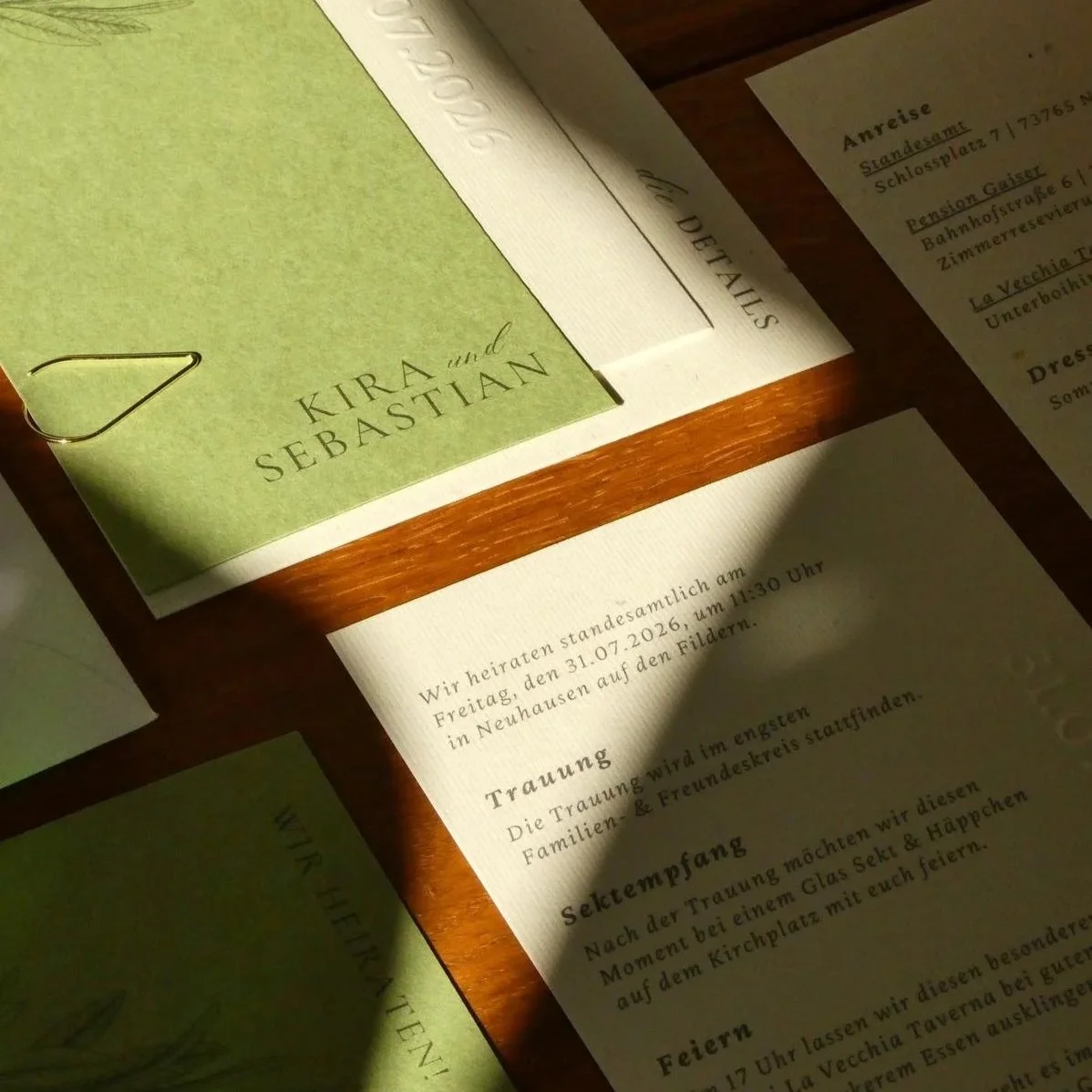 Invitation card and details for a wedding between Kira and Sebastian, with parts of the program and location information visible.