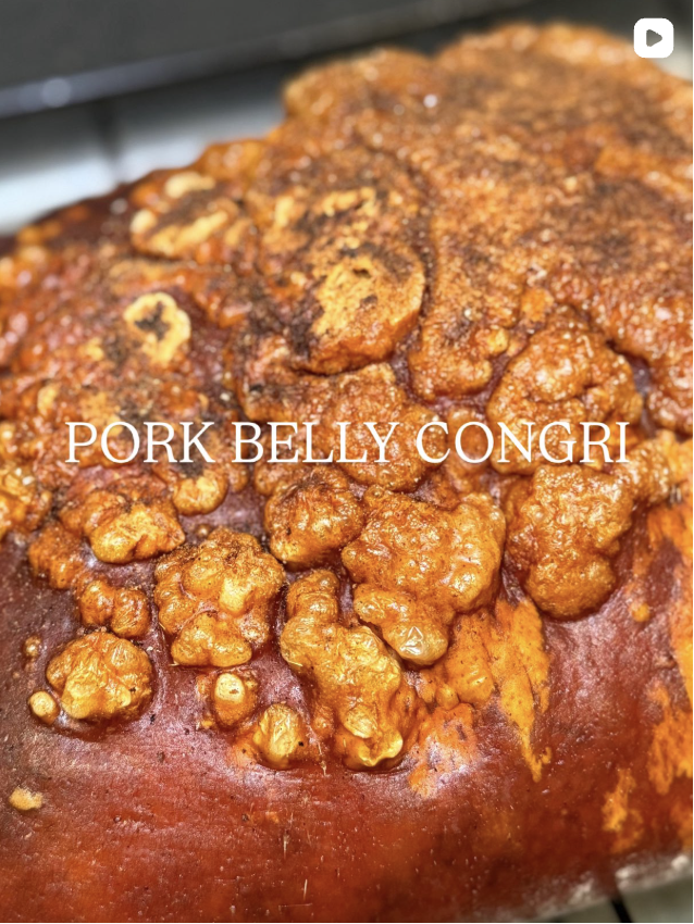 Conchita Instagram post: close-up of Pork Belly Congri with crispy golden pork crackling