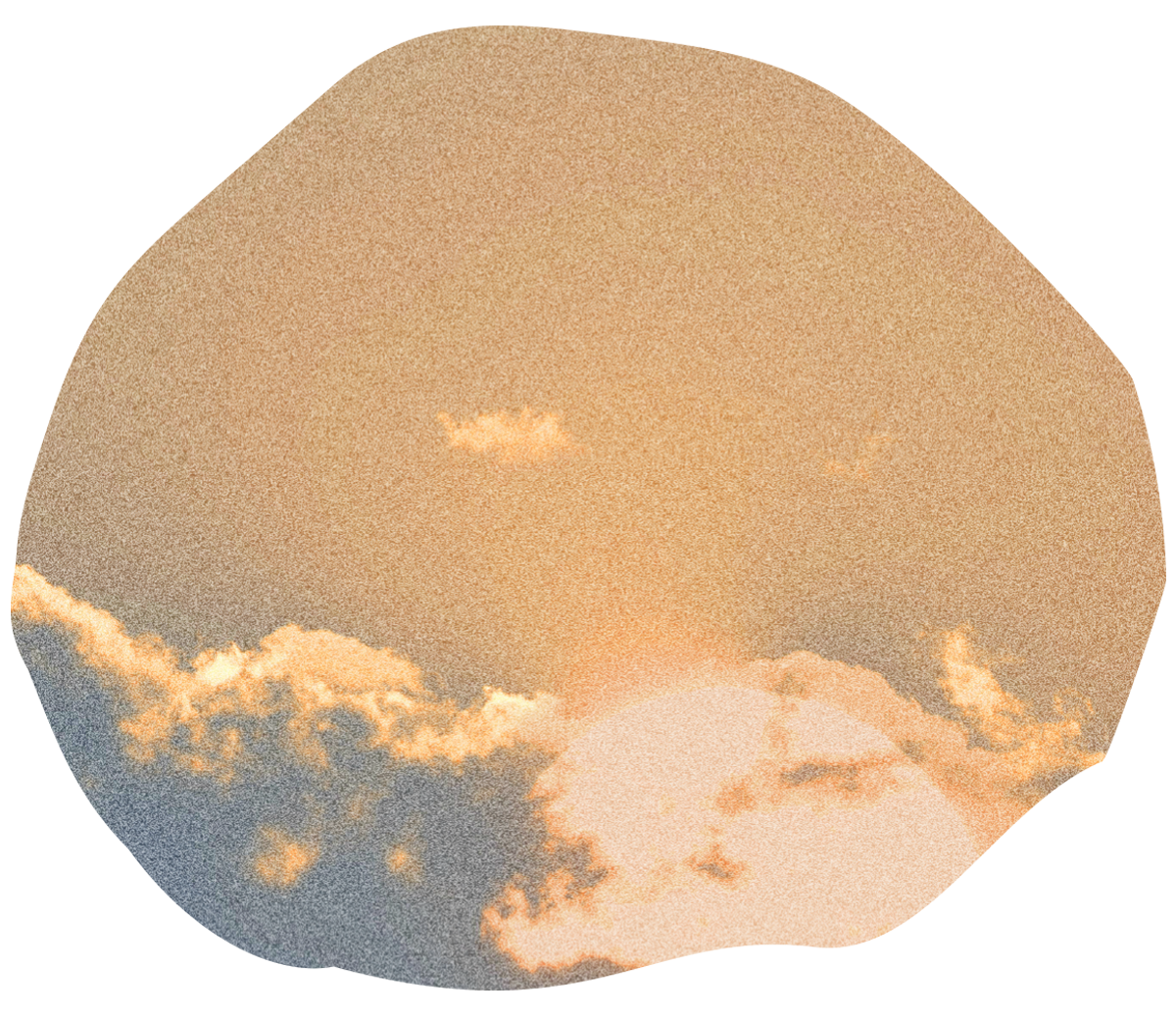 Sunset sky with clouds, orange and peach hues.