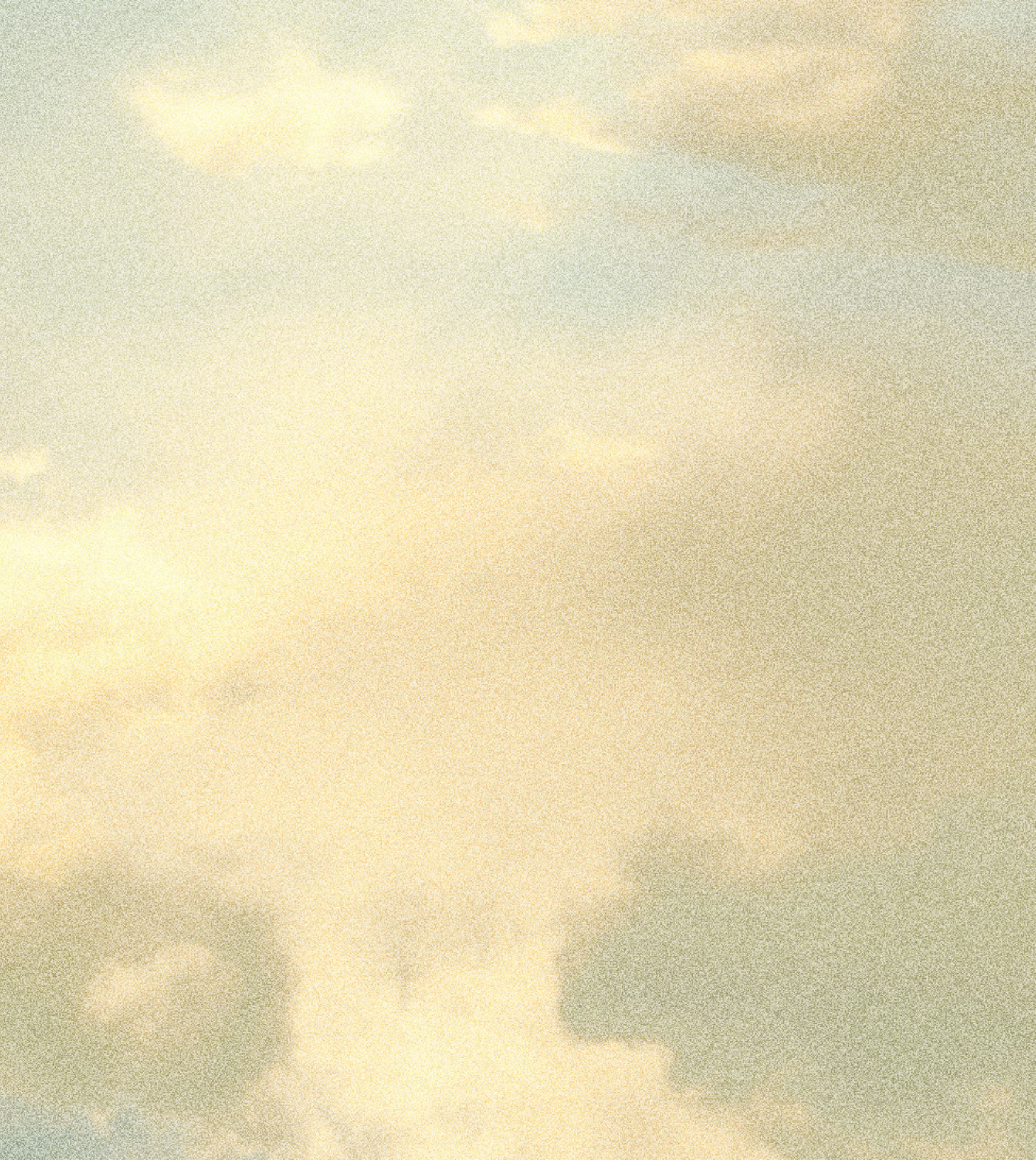 Cloudy sky with a warm, yellowish light.