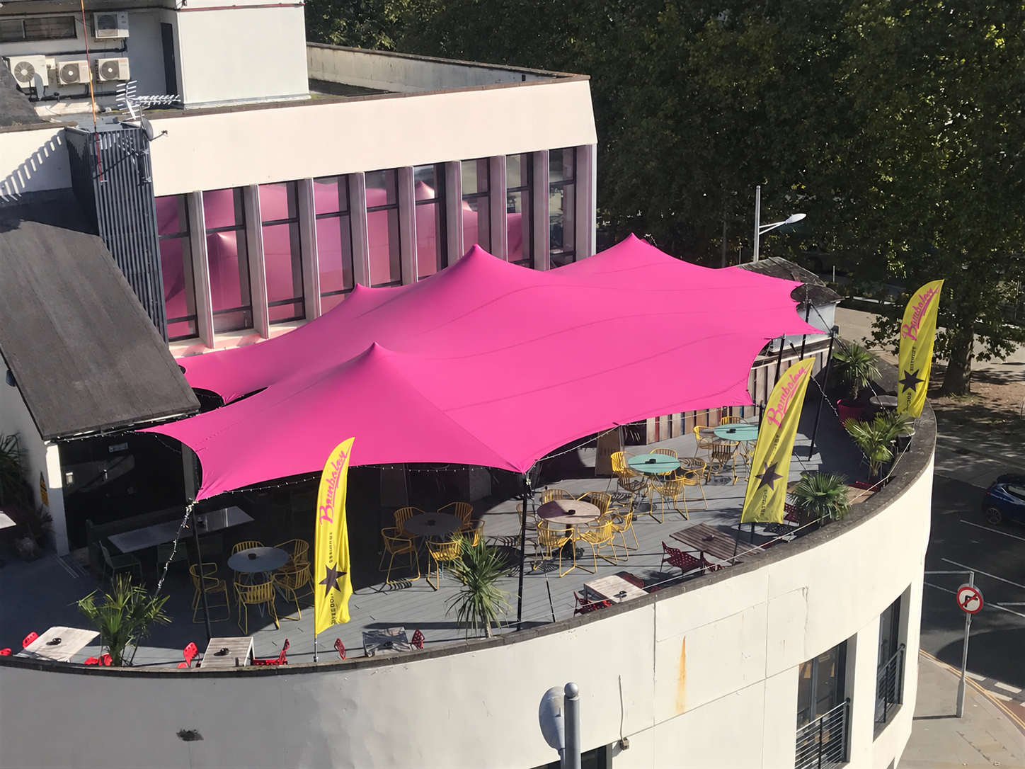 aBespoke pink stretch tent over the rooftop bar at Bambalan, Bristol, seen from above