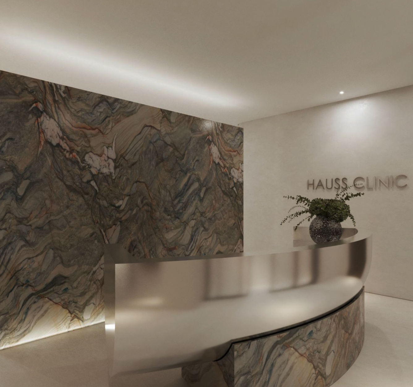 Recepção com parede de mármore marrom e cinza, balcão de metal escovado arredondado, vaso de planta com folhagem e placa com o nome 'Hauss Clinic'