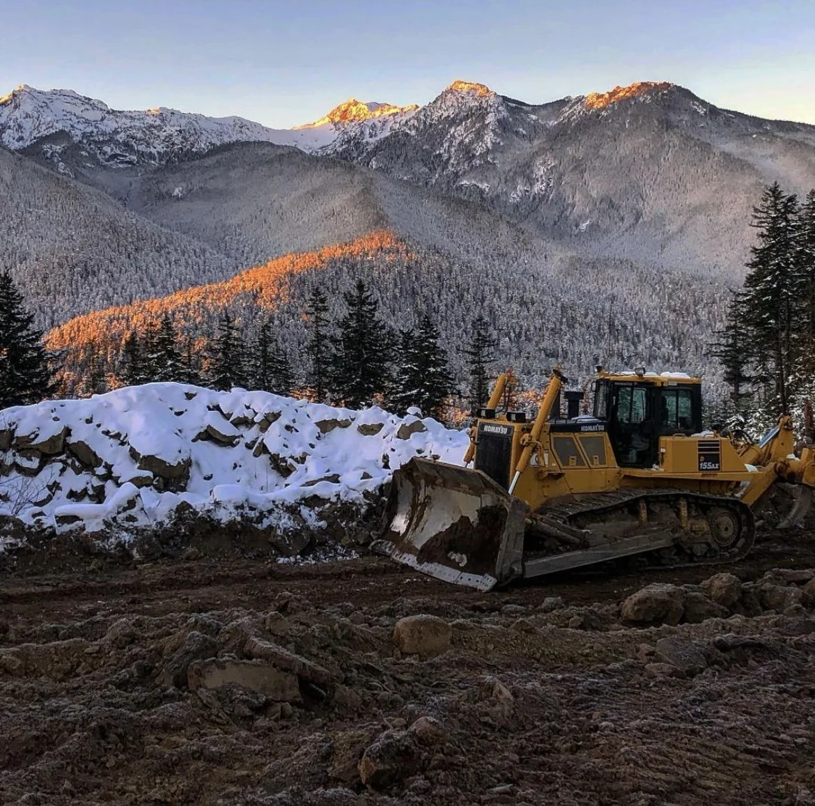 Bulldozer on high elevation timberland road build