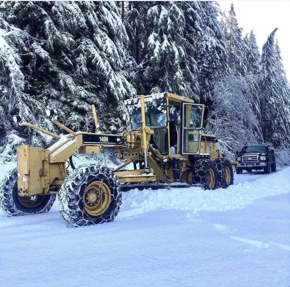 Komatsu D155 bulldozer operating on a new road.