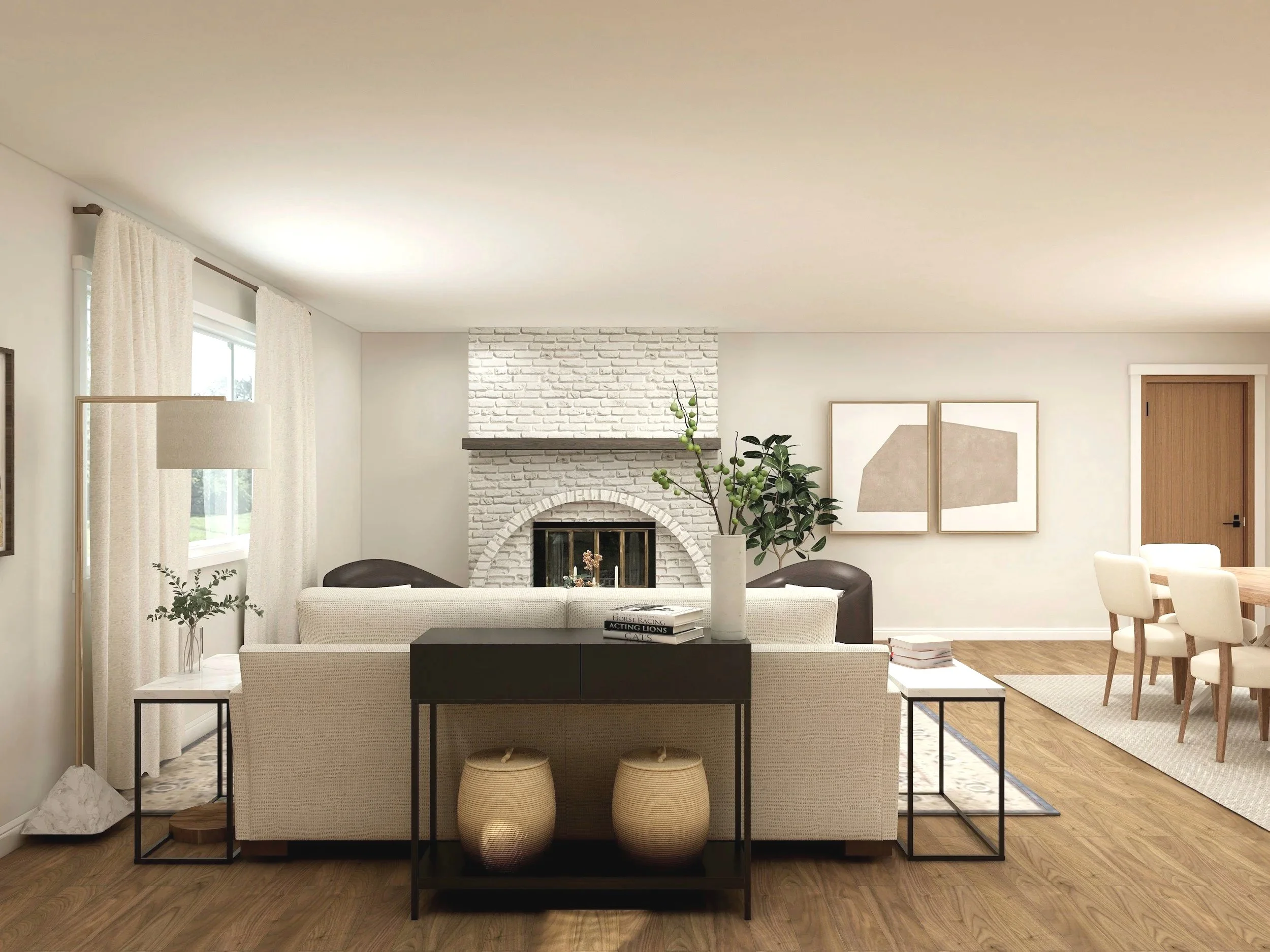 Living room with a white brick fireplace, beige sofa, black side tables, green plants, framed artwork on the wall, wooden dining table with chairs, wooden door, and hardwood flooring.