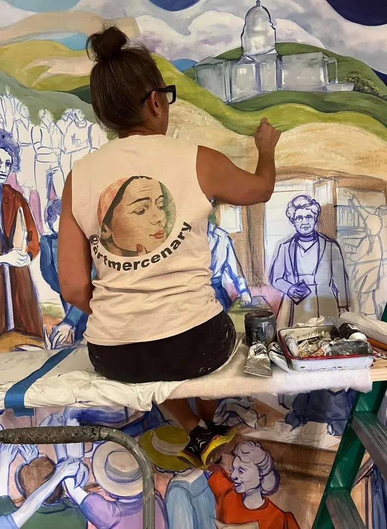 Phyllis J Garibay-Coon working on her painting "Rebel Women", permanently installed at the Kansas State Capital.