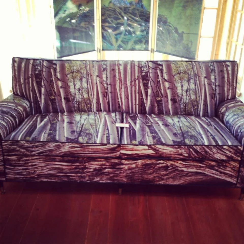 A vintage couch with a forest scene upholstery featuring Aspen trees. Photograph by Rod Mikinski printed on fabric and reupholstered by Phyllis J Garibay-Coon.
