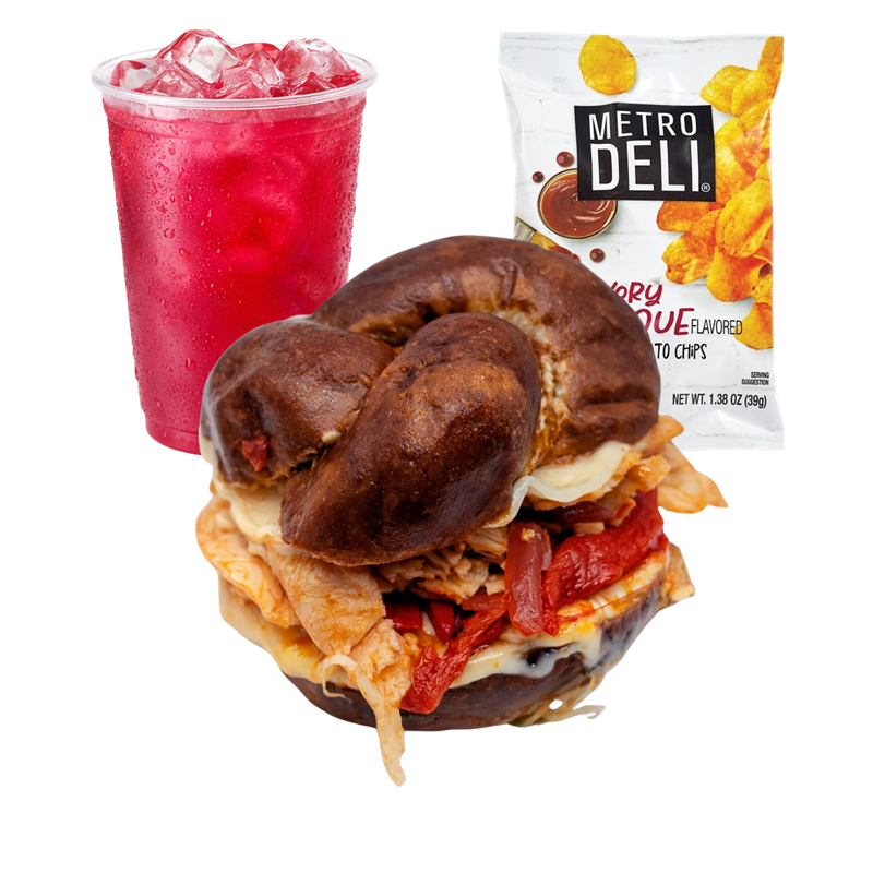 A meal consisting of a breakfast sandwich with a bagel, eggs, cheese, and cooked meats, accompanied by a red soda with ice, and a bag of Metro Deli flavored potato chips.