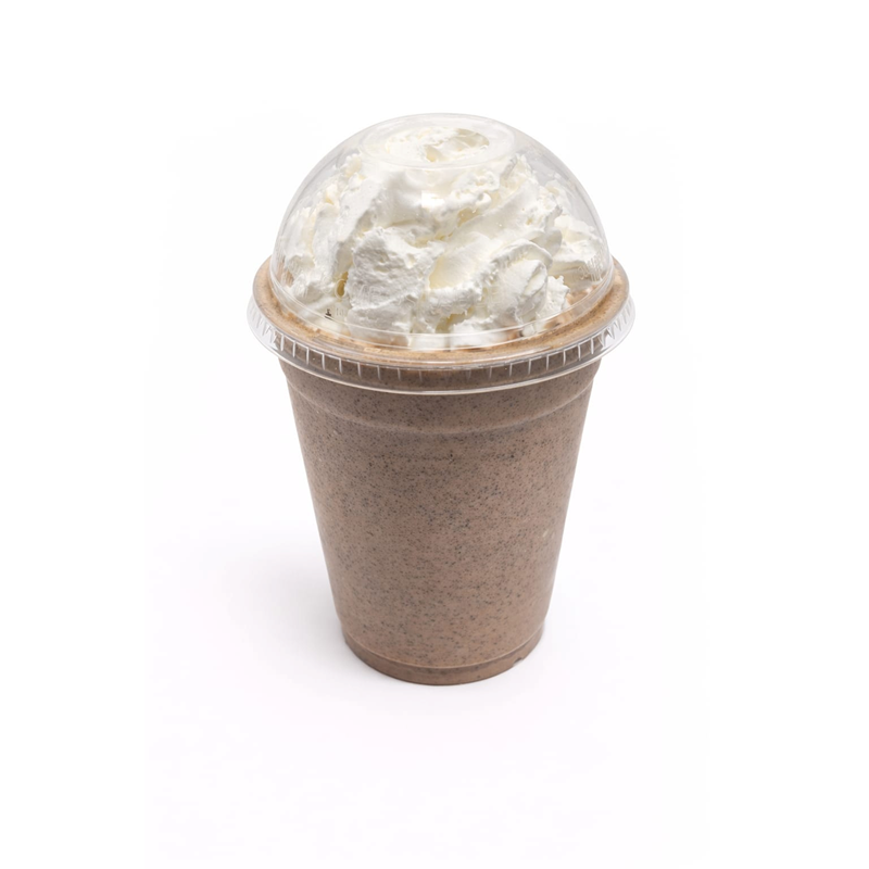 Chocolate milkshake topped with whipped cream in a clear plastic cup with a dome lid