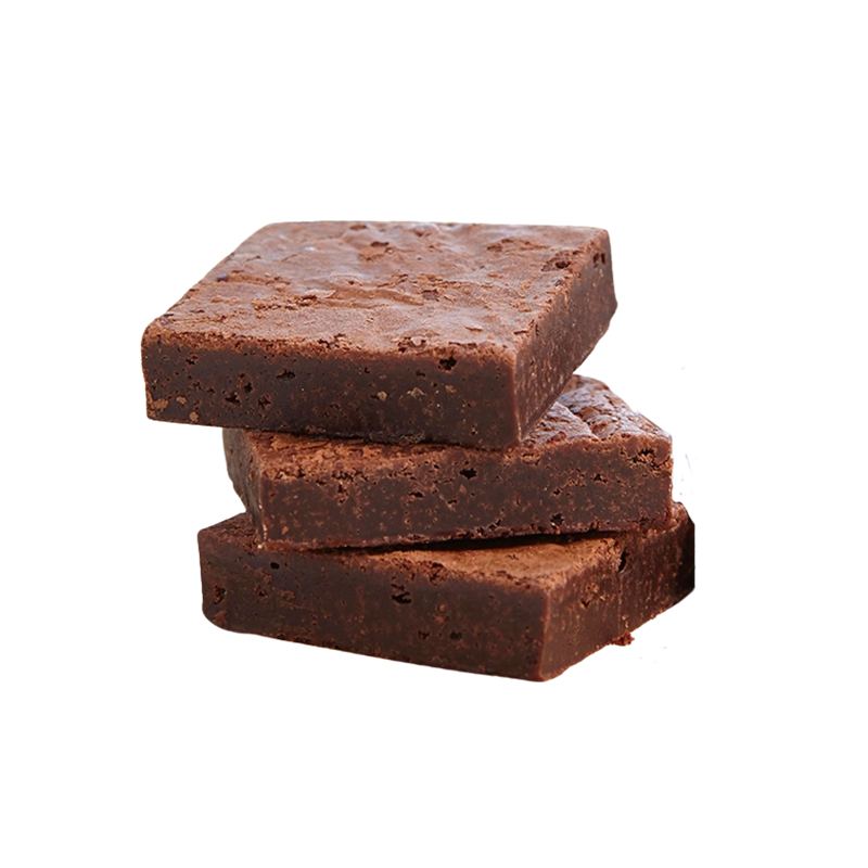 Three pieces of chocolate fudge stacked on top of each other against a white background.