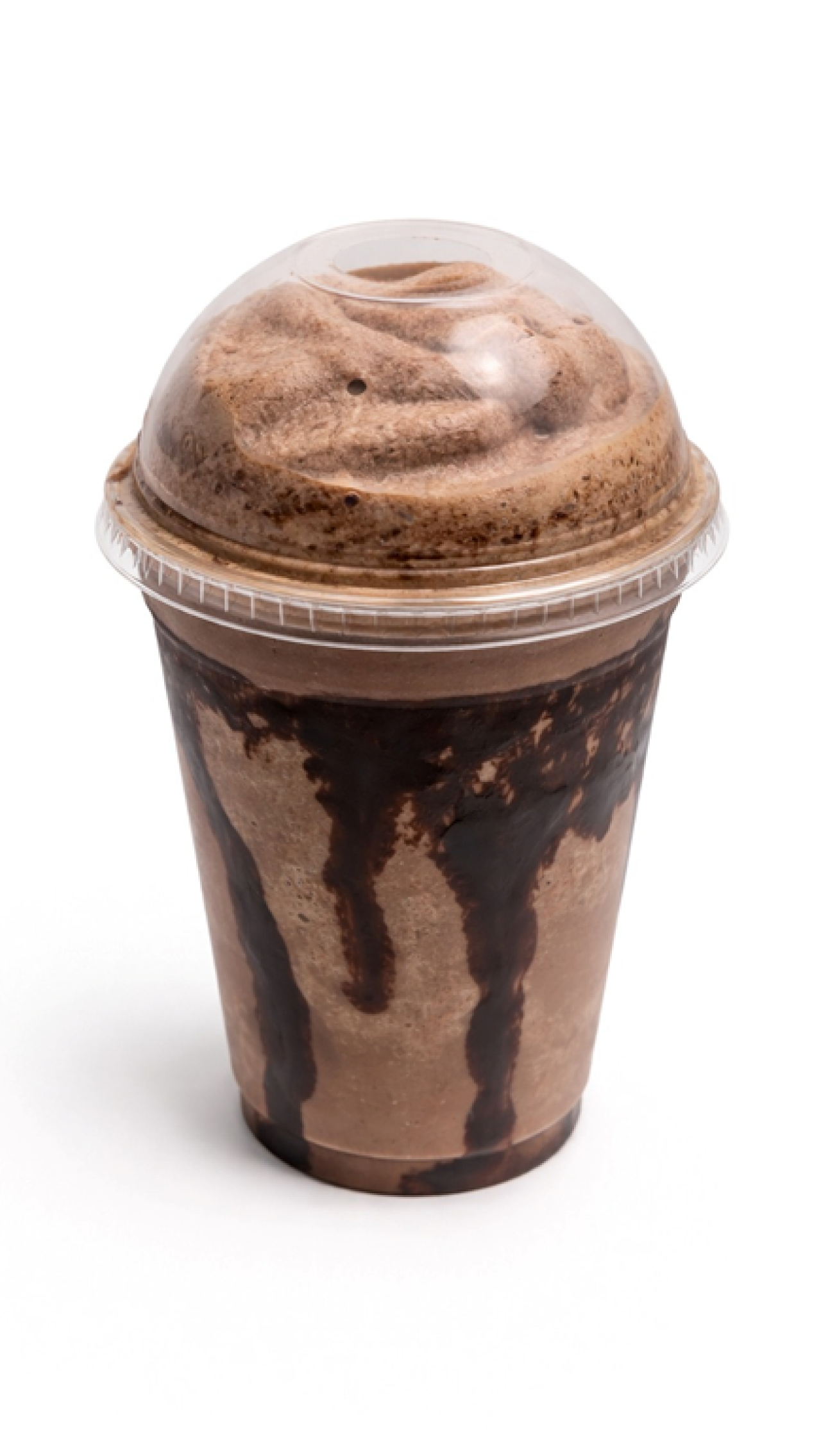 Chocolate milkshake with chocolate syrup drizzled inside clear cup, topped with whipped cream and chocolate sprinkles, against a white background.