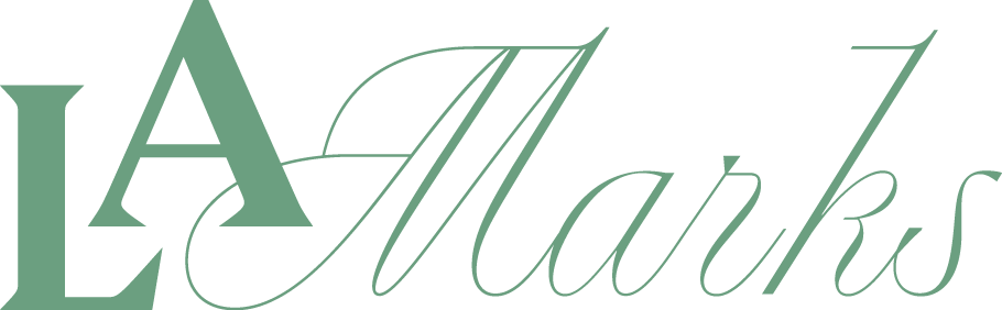 Stylized text logo reading "LA Marks" in green with elegant font.