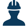 Silhouette of a construction worker wearing a hard hat.