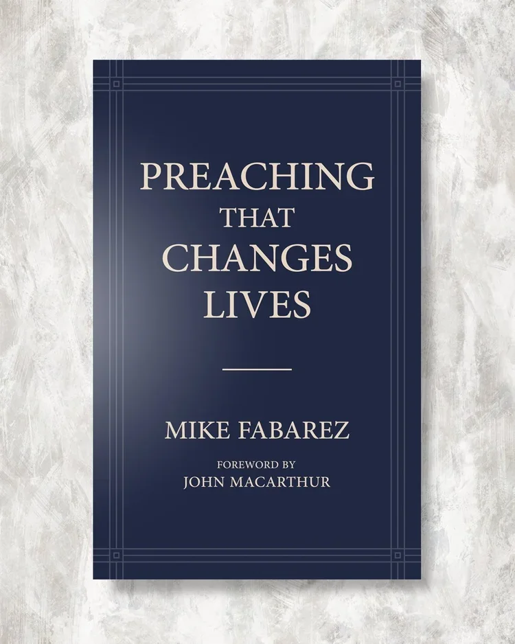 Book cover titled 'Preaching That Changes Lives' by Mike Fabarez, with foreword by John Macarthur, set against a light textured background.