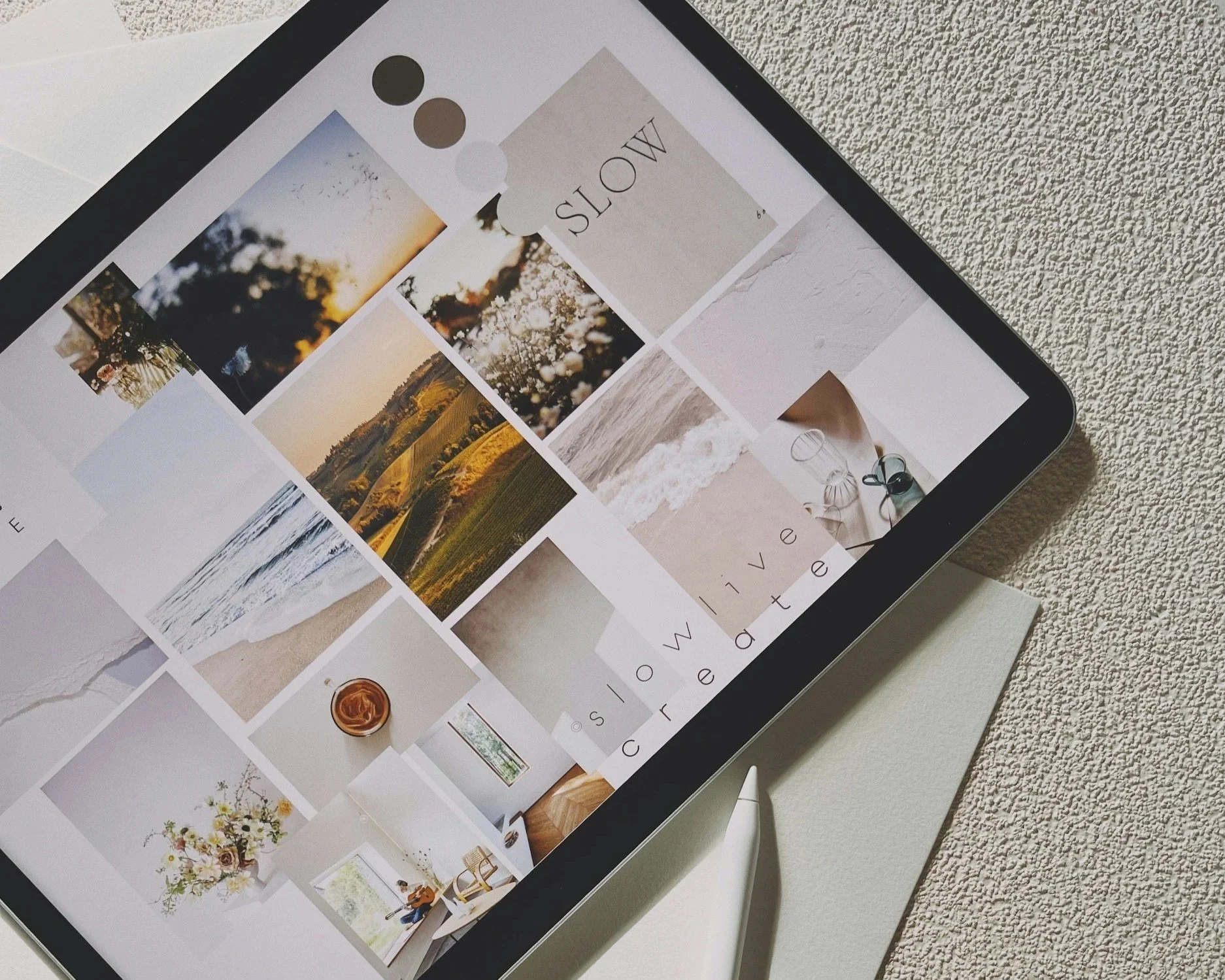 An iPad on a table displaying a photo collage app with various nature and lifestyle images and the words 'slow' and 'live'.
