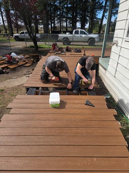 The Coastal Construction team building a new deck. See the big reveal below.