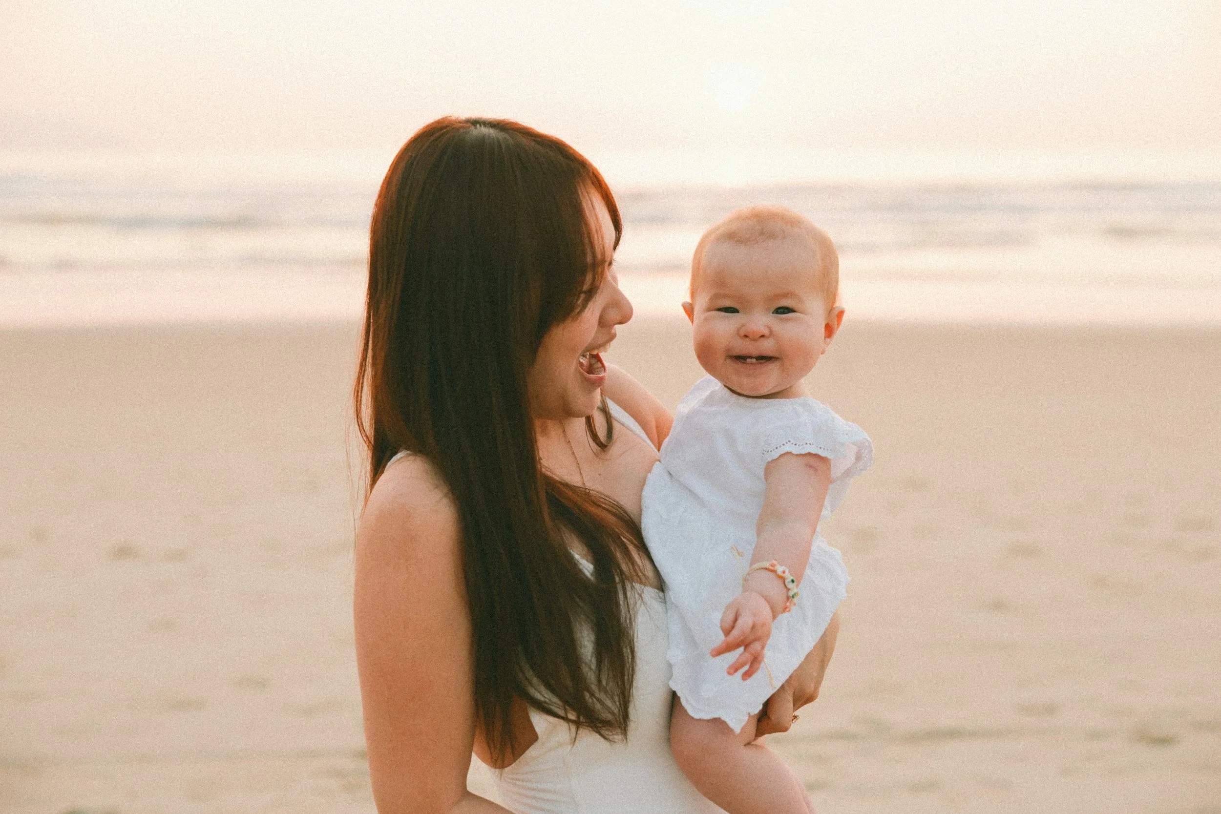 Mother holding infant with lip tie — in-home oral tie assessment and feeding support by IBCLC and occupational therapist in Ojai California