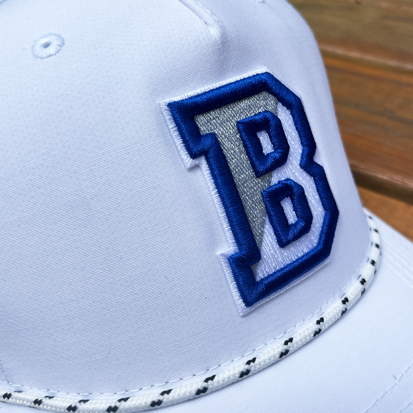 close up white embroidered alt.png