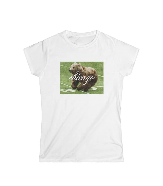 White T-shirt with a graphic of a bear on a football field and the word 'Chicago' written across it.