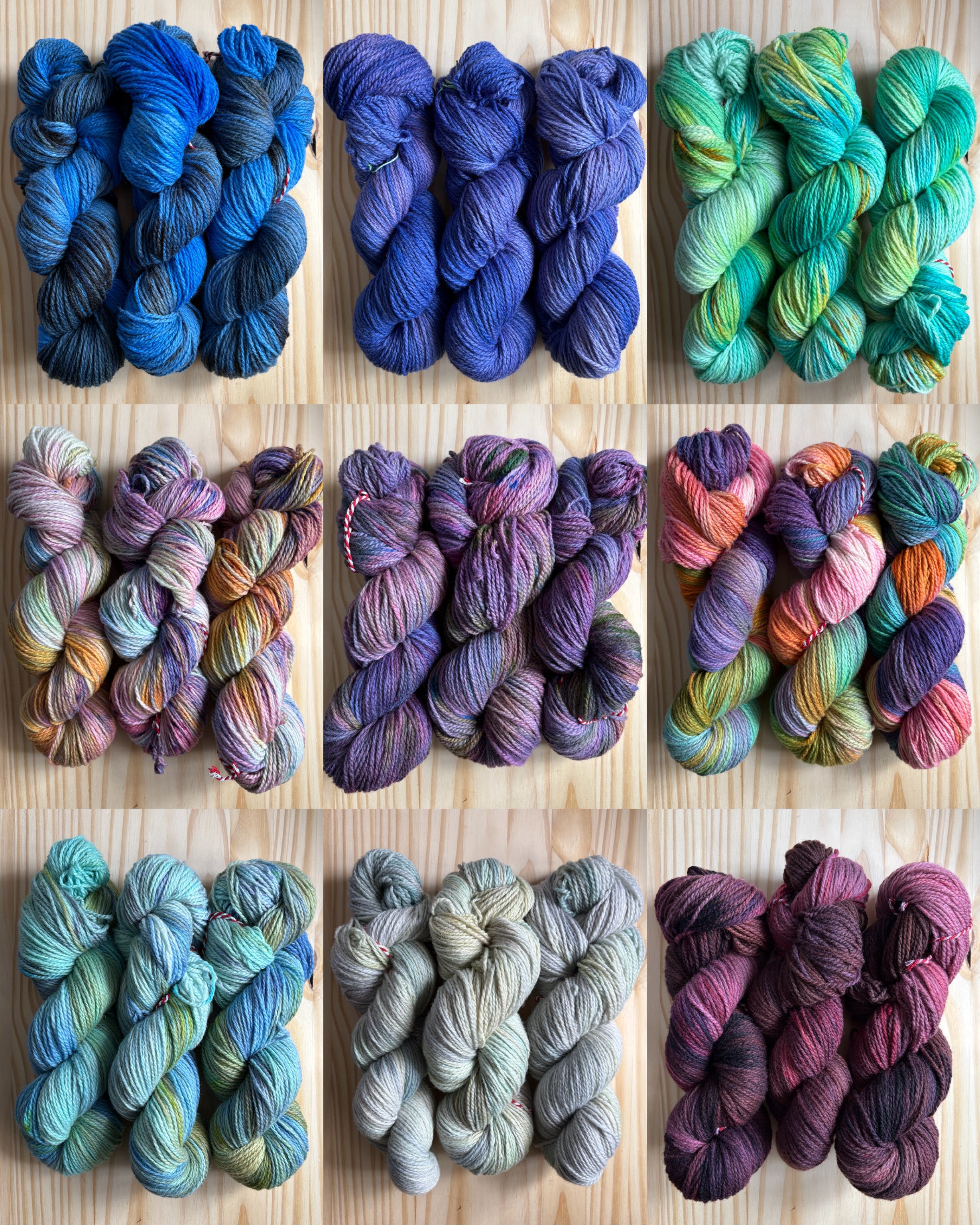 Nine sets of colorful yarn skeins arranged on a wooden surface in a 3x3 grid.