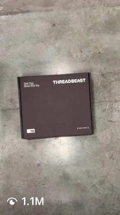 A black box labeled 'ThreadBeast' on a concrete floor.