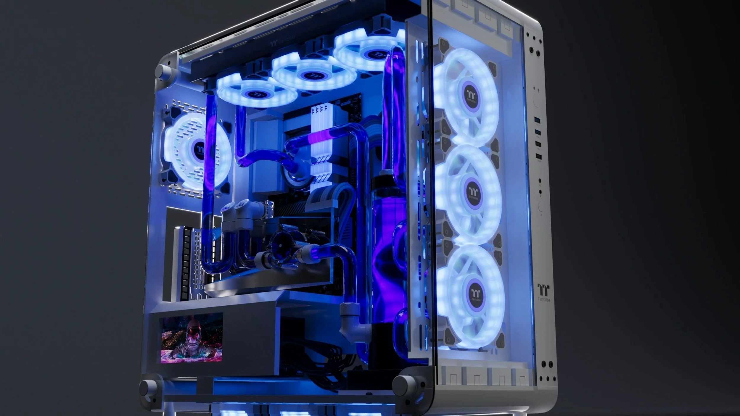 A high-performance gaming computer with a custom white and black case featuring transparent side panels, illuminated by blue LED lights, with cooling fans, liquid cooling tubes, and various hardware components visible.