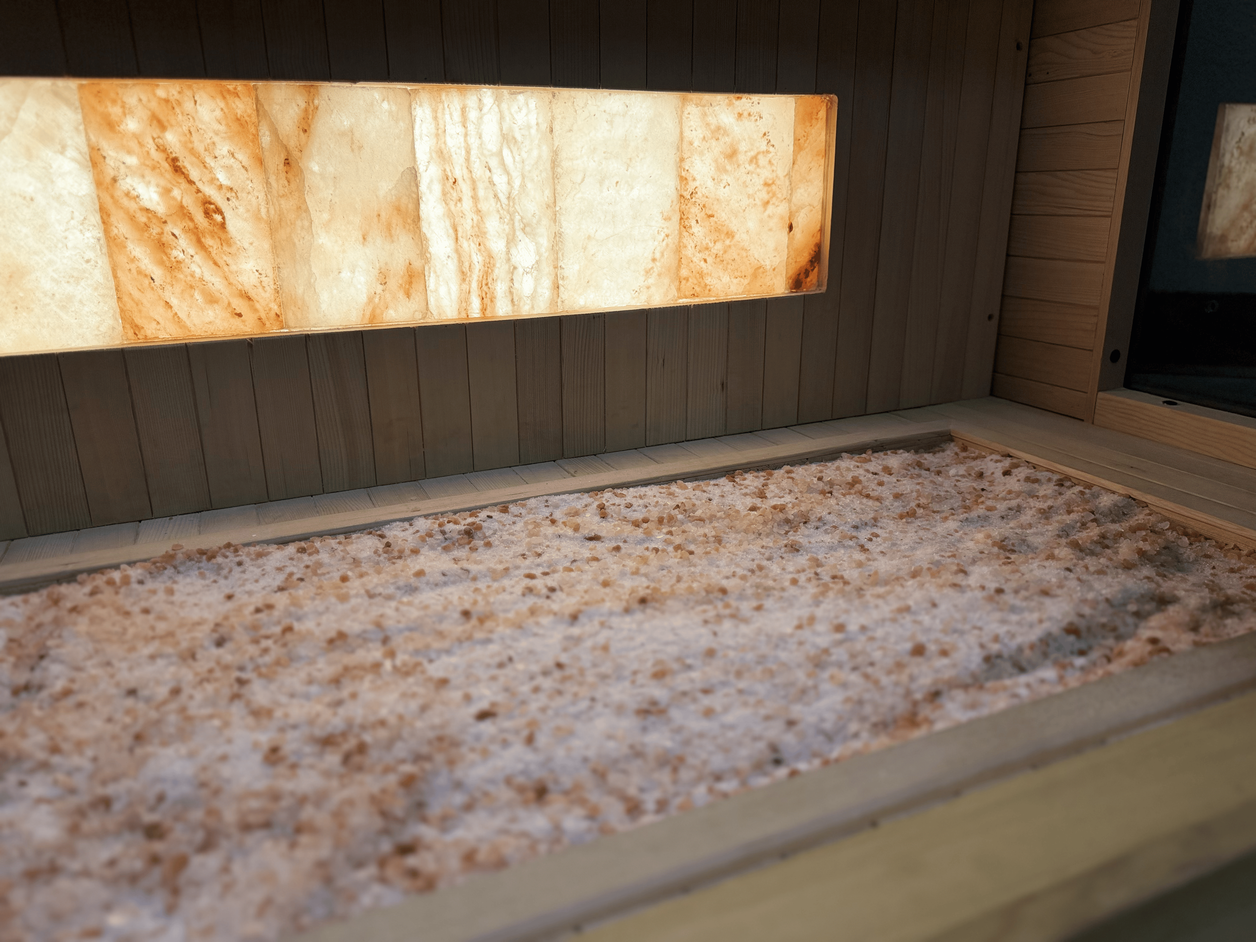 Natural salt on floor in halotherapy booth.