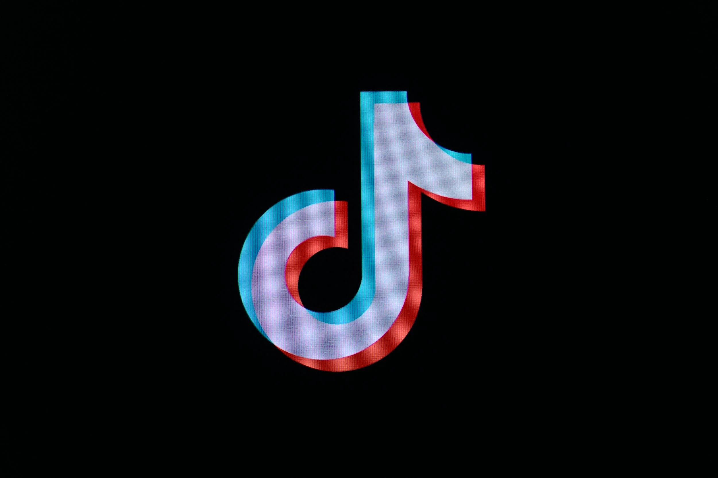 TikTok logo on a black background.