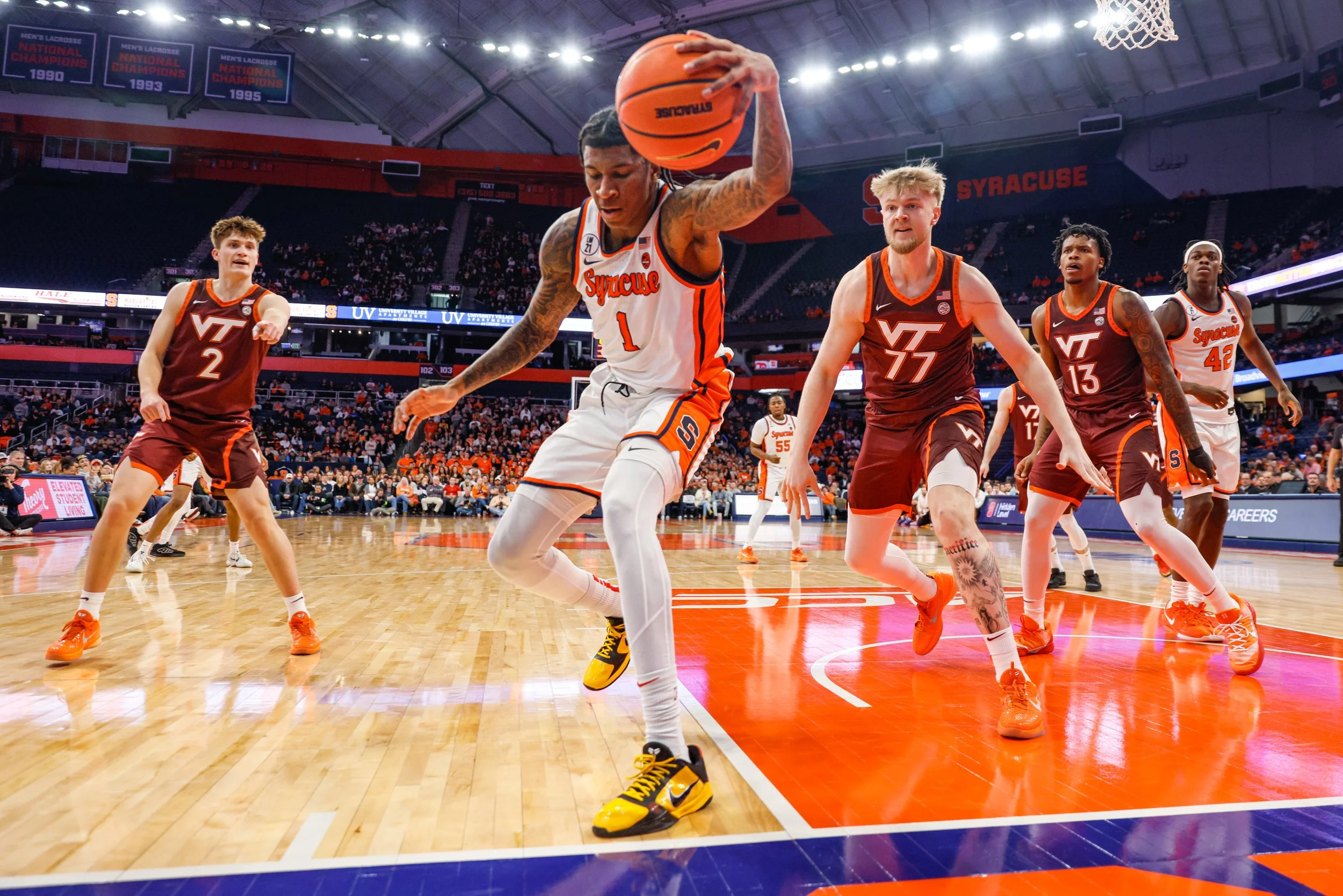 Syracuse sophomore forward Donnie Freeman saves the ball from going out of bounds during the first half of a game against Virginia Tech on Wednesday, Jan. 21, 2026, at the JMA Wireless Dome in Syracuse. Virginia Tech held on to beat Syracuse, 76-74. 