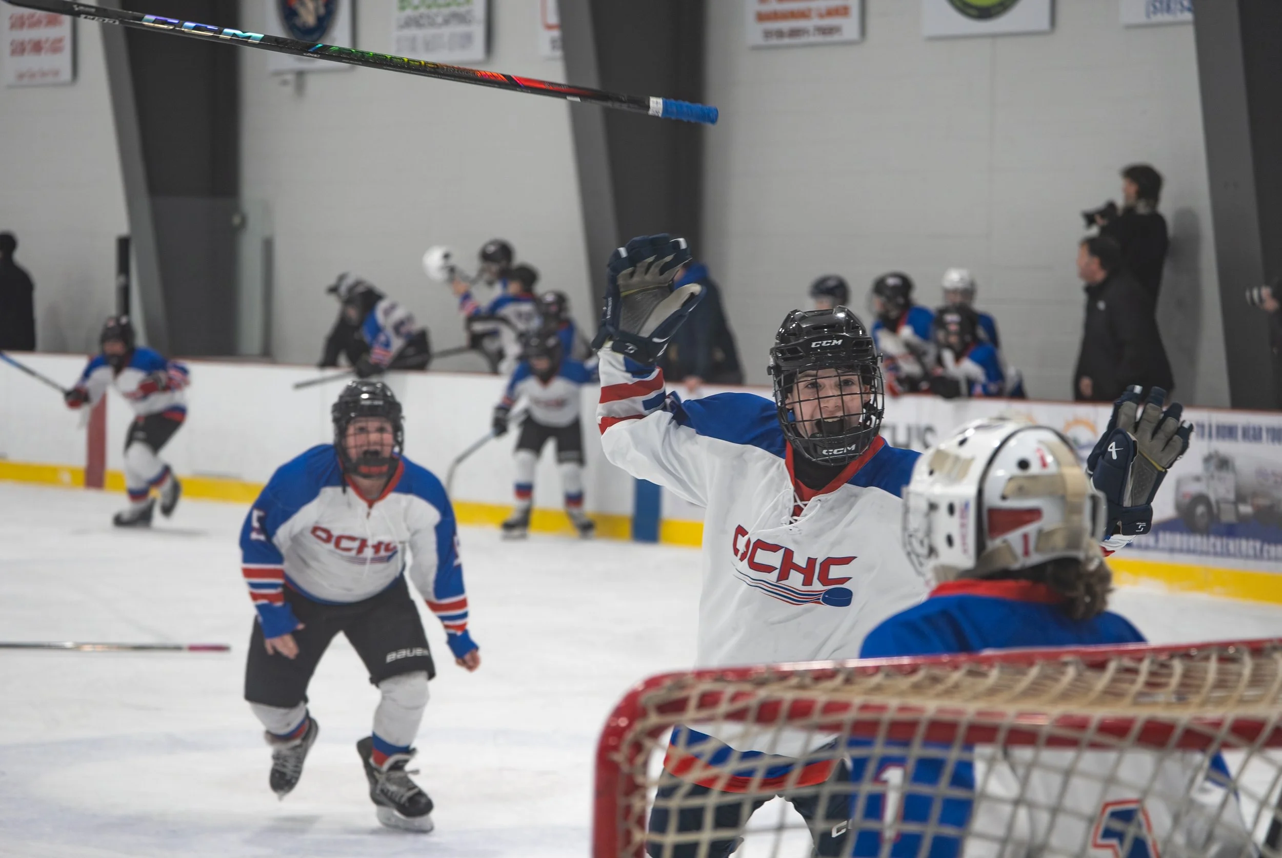 New Hartford Hockey Club player Liam Bailey celebrates with goaltender Maximus Freed after defeating Chazy Selects in the gold medal game on Feburary 8, 2026 at the Saranac Lake Civic Center in Saranac Lake, NY. (Isaac Williams/The Newhouse School)