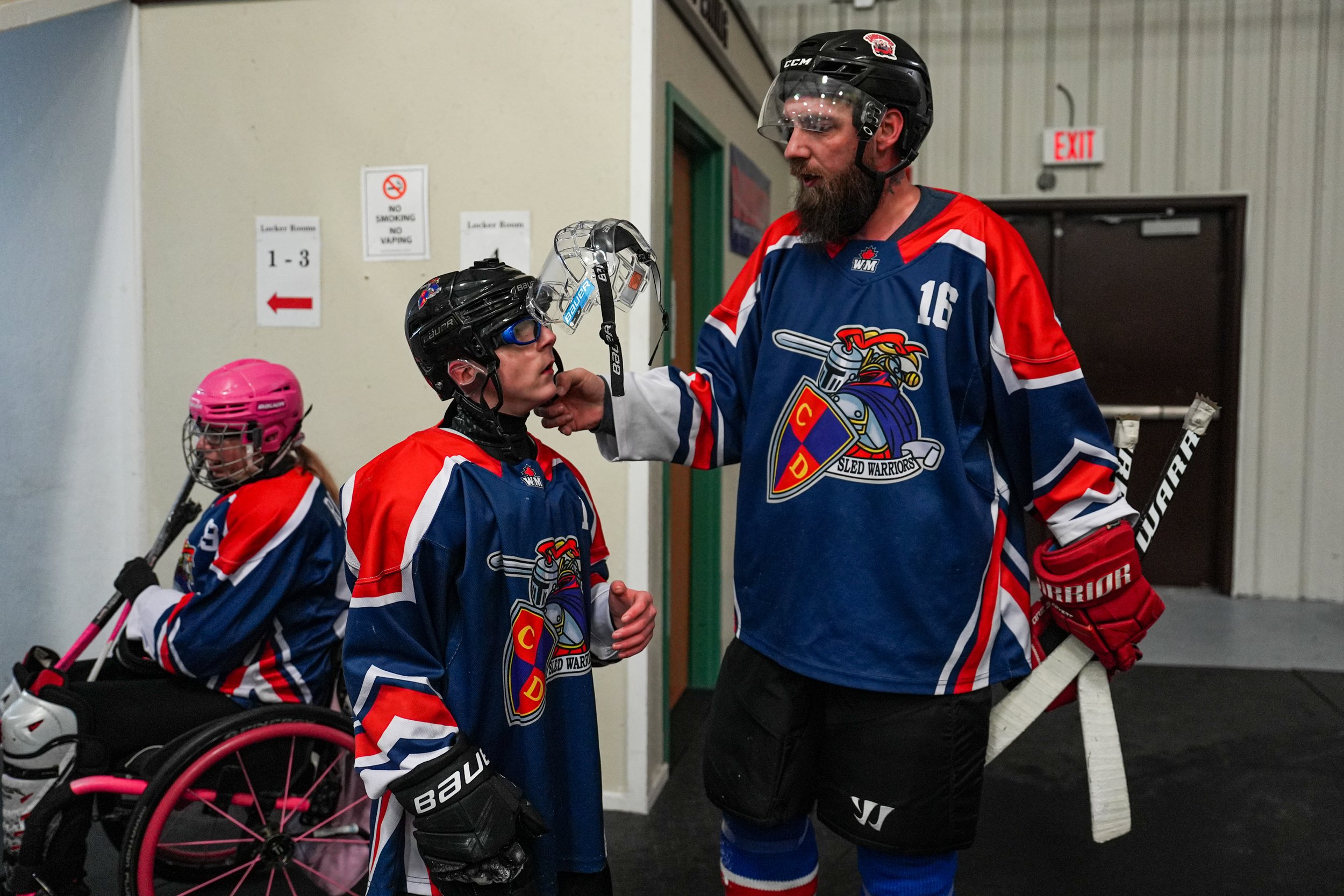 Capital District Sled Warriors player Lyle Joiner is embraced by his teammate during his game vs CNY Flyers on February 6, 2026 at the Tupper Lake Civic Center in Tupper Lake, NY. (Isaac Williams/The Newhouse School)