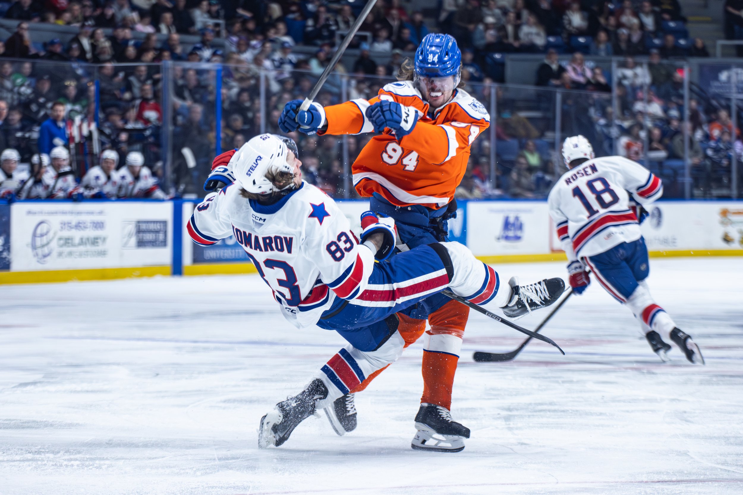 Syracuse Crunch forward Conor Geekie levels Rochester Americans defenseman Vsevolod Komarov with an open-ice hit during the Crunch's 3-1 win on Sunday, March 1, 2026, at the Upstate Medical University Arena in Syracuse. (Isaac Williams/The NewsHouse)