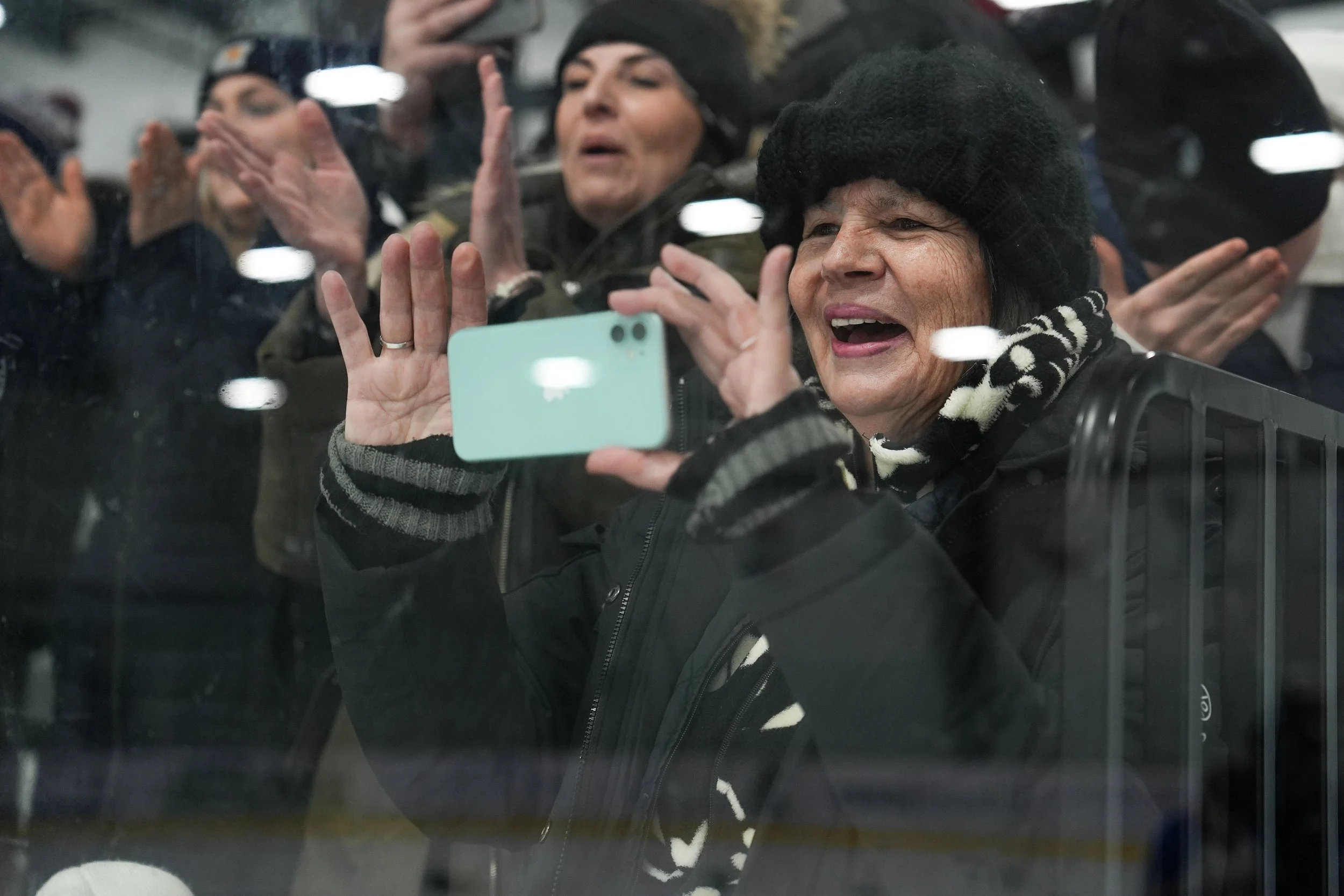 Supporter captures the moments after New Hartford Hockey Club win against Chazy Selects at the gold medal game on Feburary 8, 2026 at the Saranac Lake Civic Center in Saranac Lake, NY. (Isaac Williams/The Newhouse School)